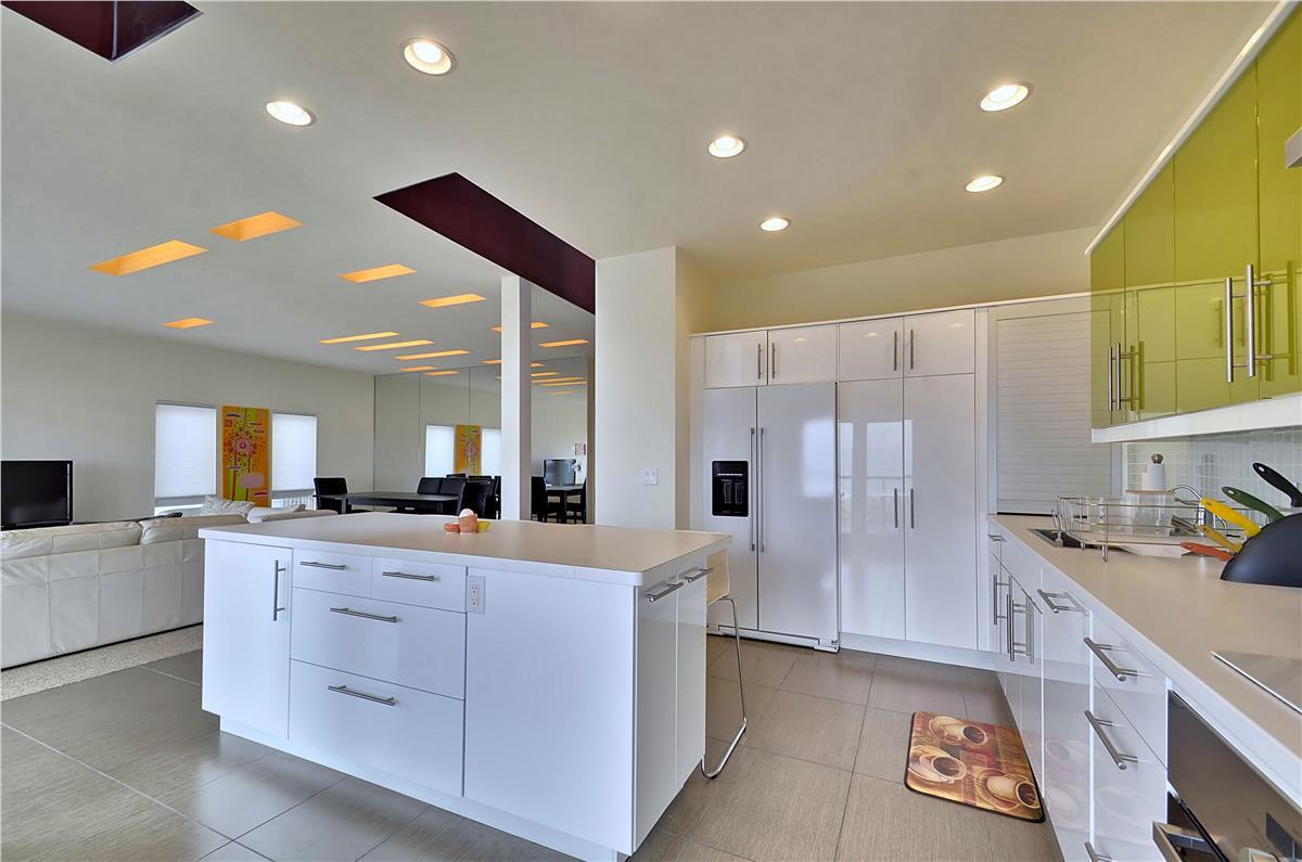 Your sleek, fully equipped kitchen opens seamlessly into the living space—plenty of counter room for meal prep and morning coffee before heading out to explore.