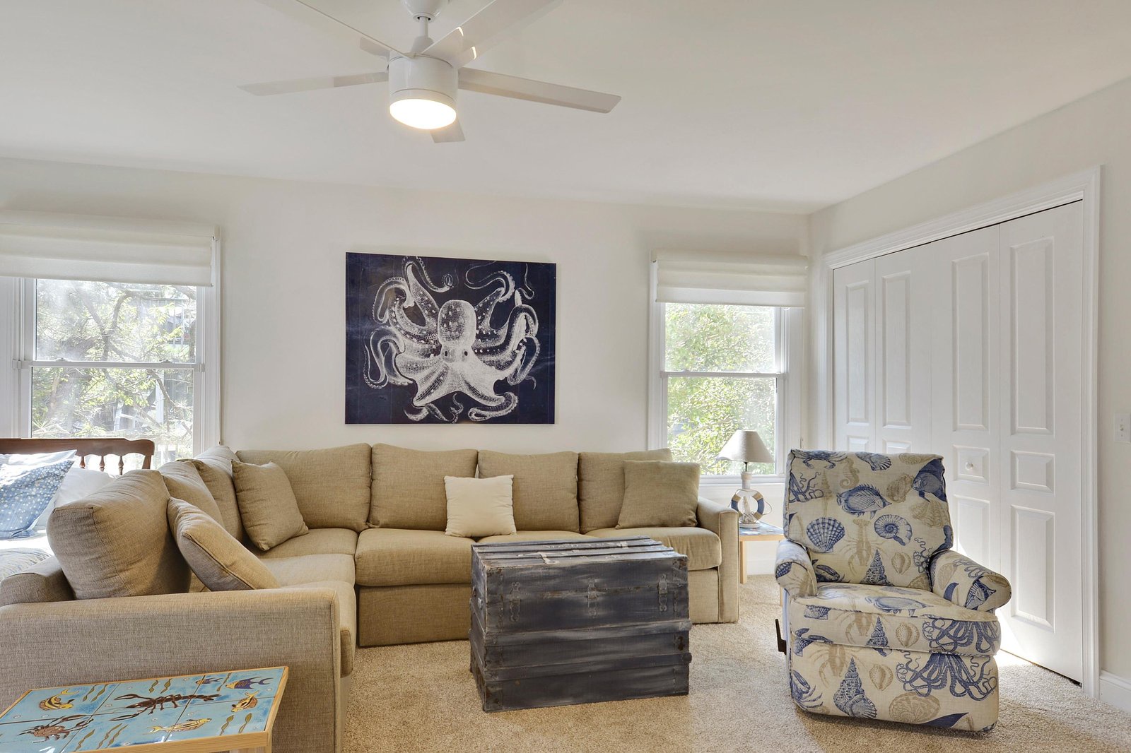 Sink into plush coastal comfort in your private living space, where ocean-themed touches and warm natural light create the perfect retreat after a day exploring the shore.