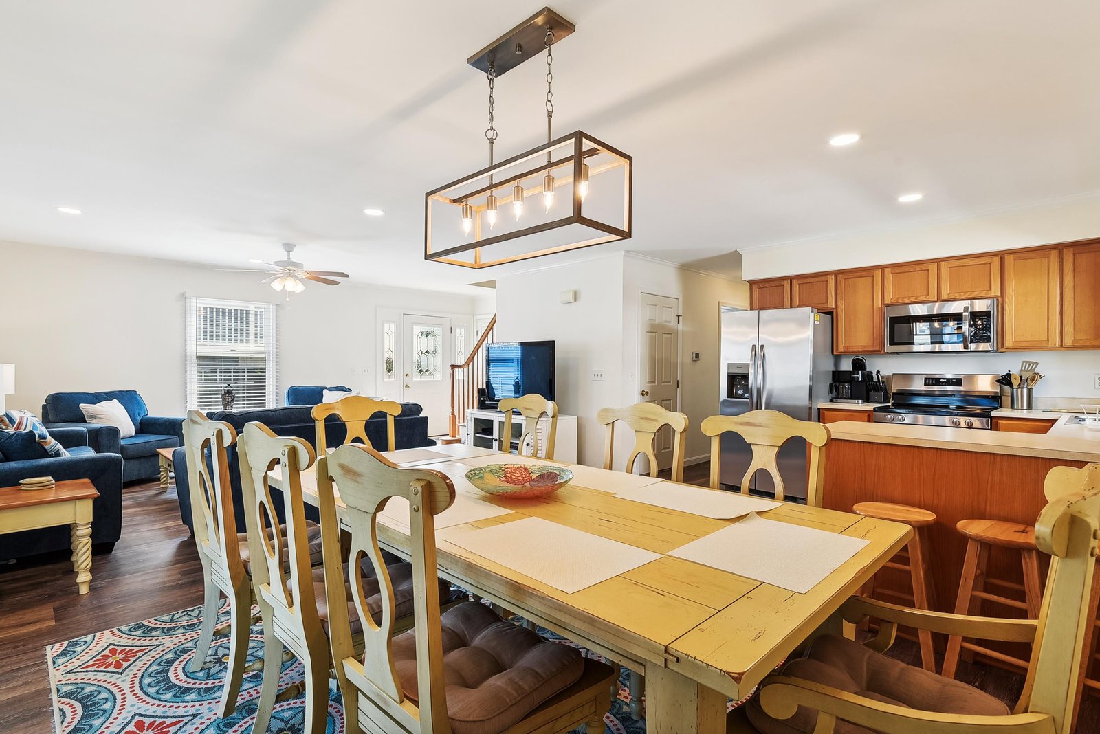 Gather around the spacious dining table, where every meal becomes a celebration. The open-concept design flows into a welcoming living area and well-equipped kitchen, creating the perfect space for your group to cook, dine, and relax together.