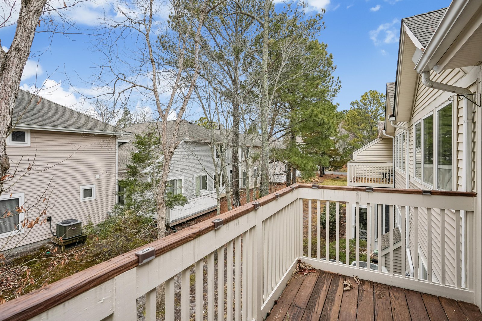 A quiet residential area with mature trees, providing a peaceful backdrop for the property and neighboring homes.