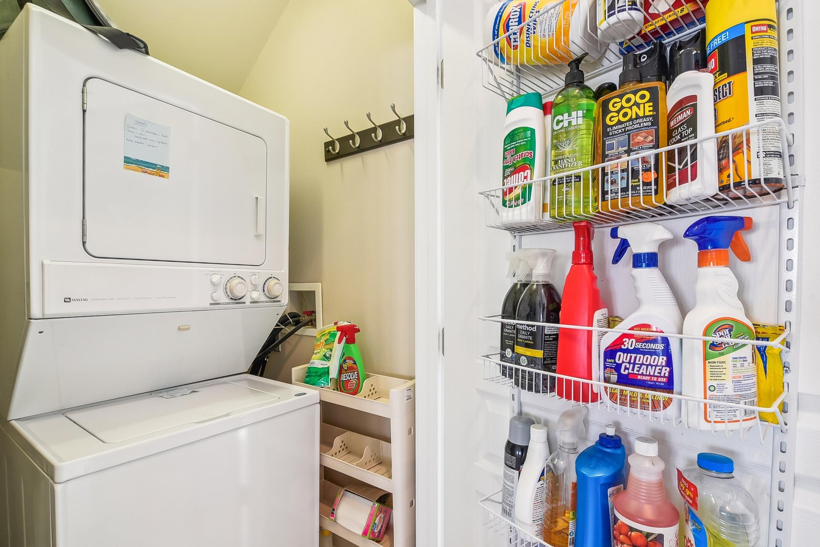 A well-stocked utility closet keeps your stay carefree—with a stacked washer-dryer unit and plenty of cleaning supplies, you'll have everything you need for a comfortable, hassle-free getaway.