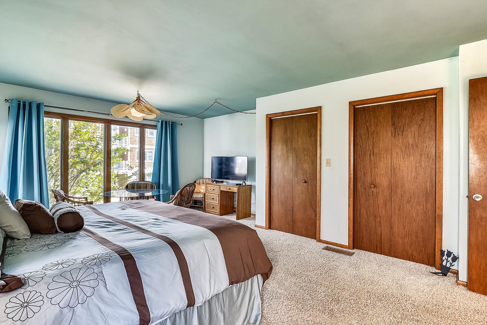 Unwind in your spacious bedroom with peaceful views and plenty of natural light. Cozy linens await your arrival, and ample storage keeps your space serene and organized.