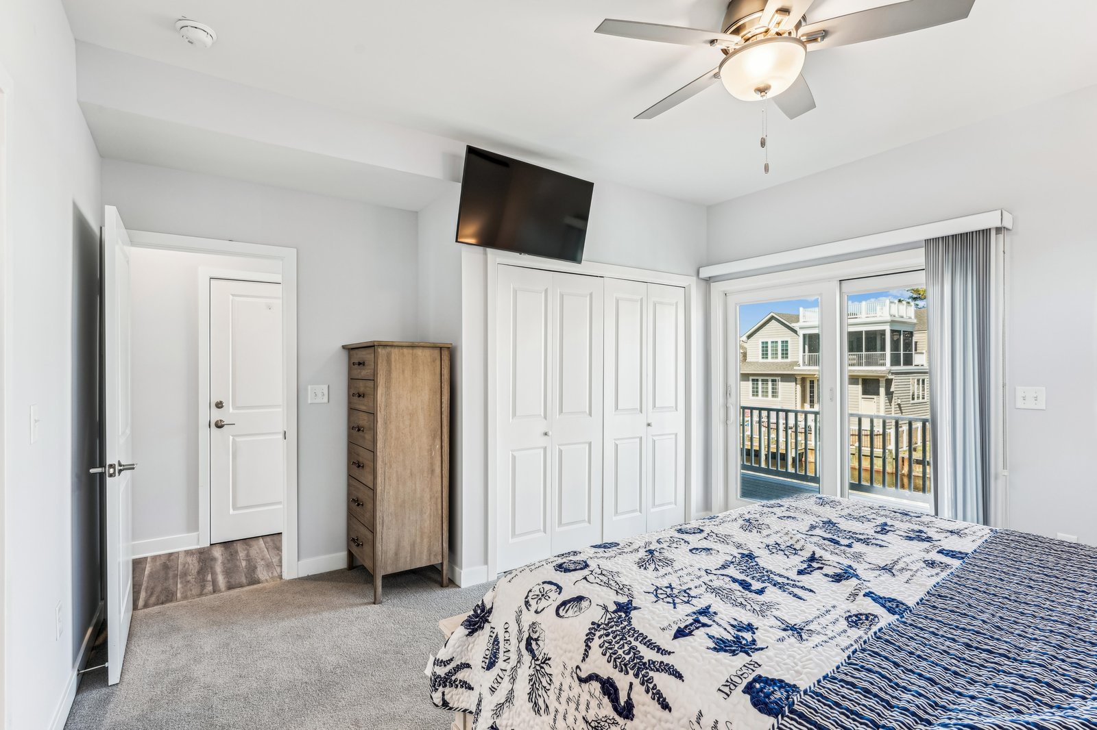 Your peaceful retreat awaits, with a ceiling fan to keep you cool and a private balcony inviting you to step outside and enjoy the fresh air.
