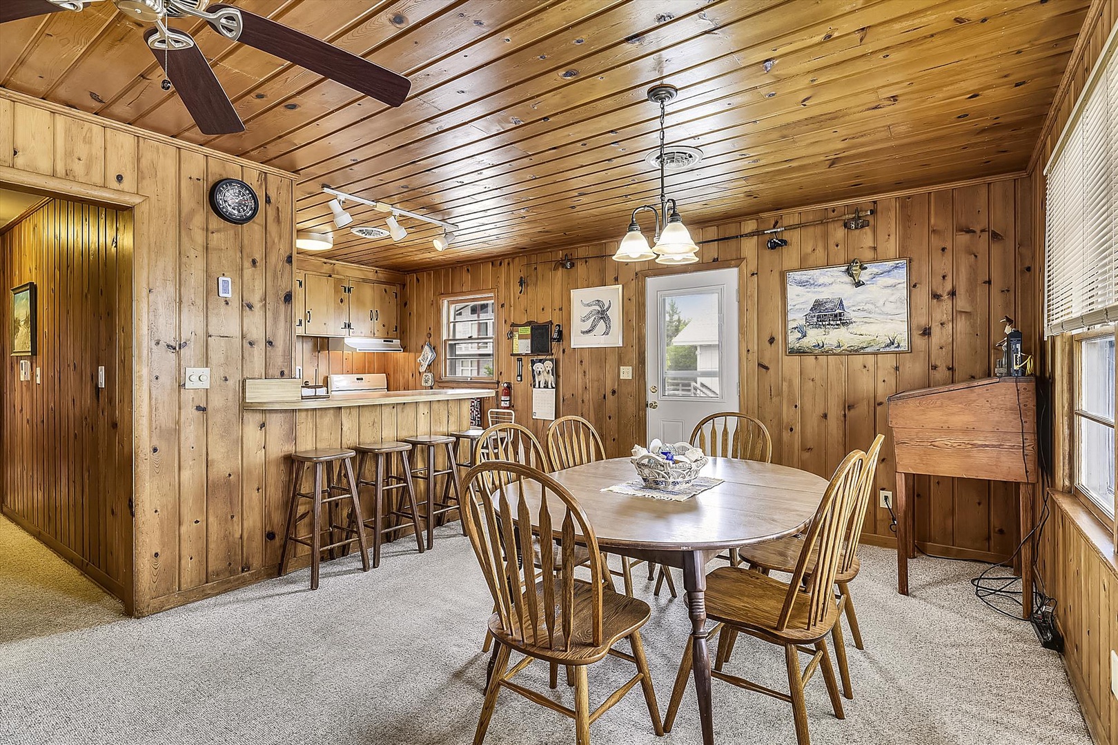 Gather around this cozy dining space where warm wood finishes and rustic charm create the perfect setting for your meals together and memorable conversations.