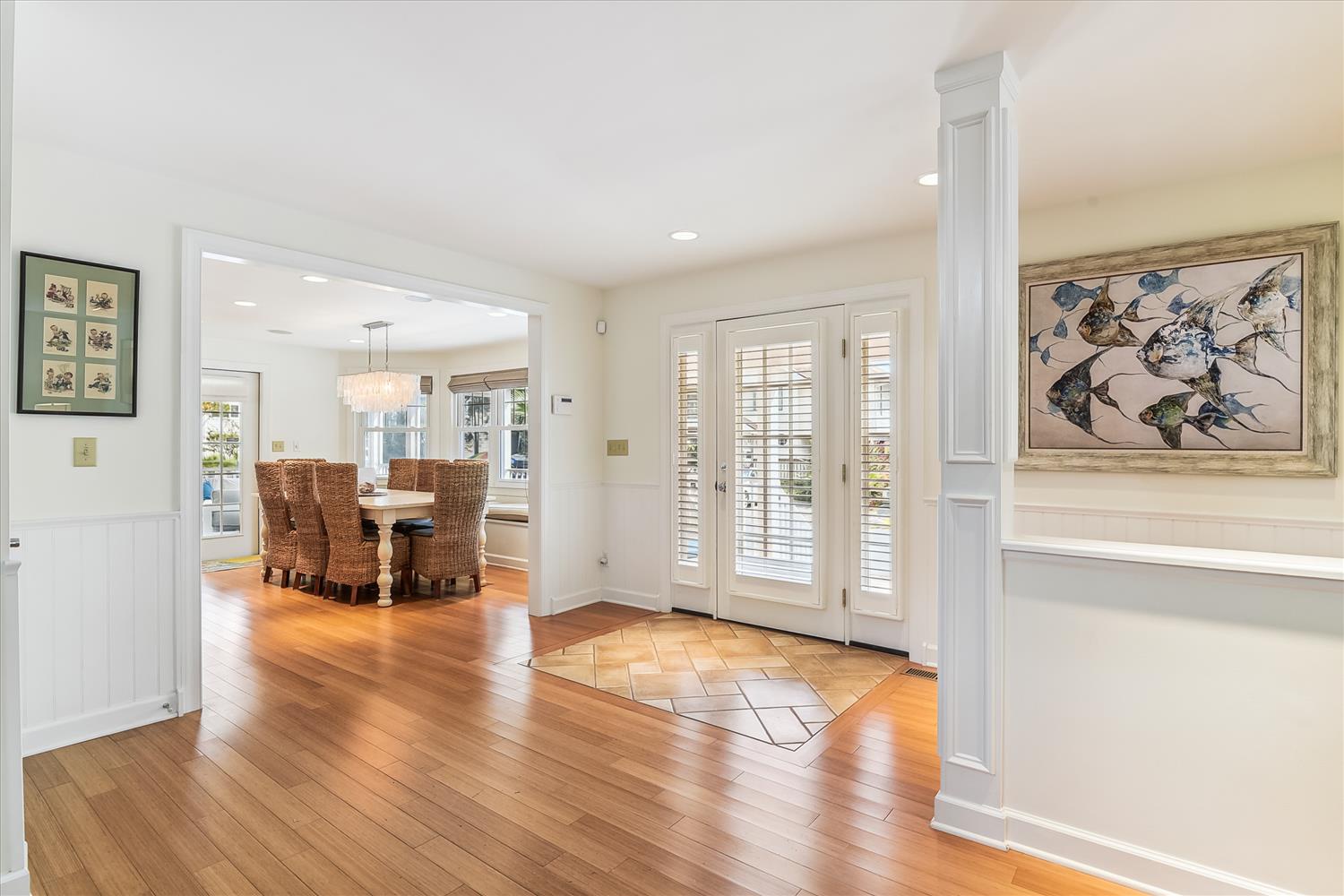 Step into this bright and welcoming home where gleaming hardwood floors lead you through open, airy spaces perfect for relaxing or entertaining.