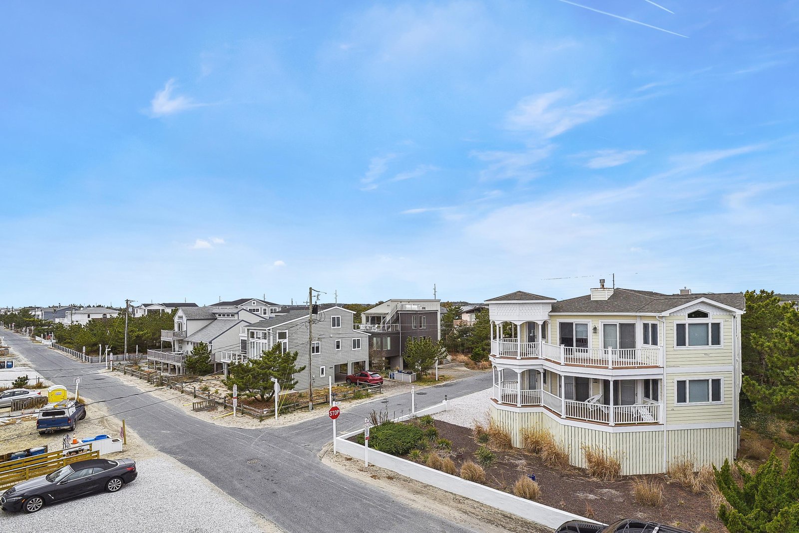Situated in a serene beachside neighborhood, this property features charming coastal architecture with multiple balconies and easy access to sandy shores.