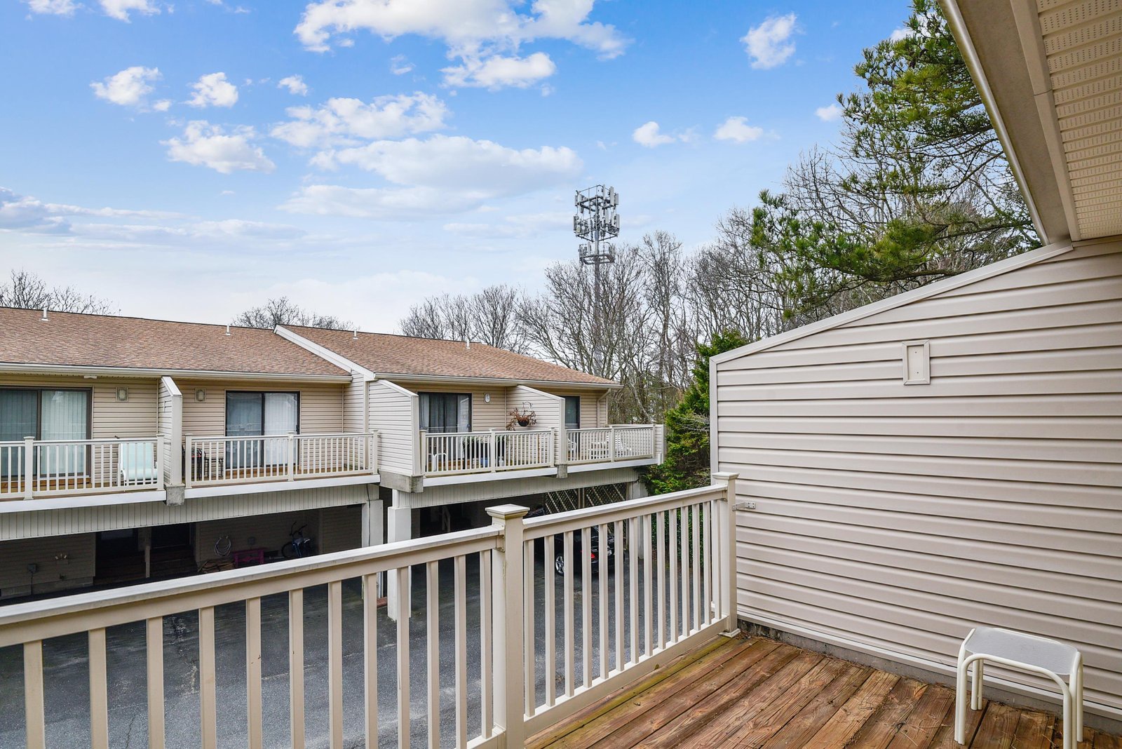 Your private balcony opens to quiet tree-lined views, offering a peaceful spot to unwind and breathe in the fresh air.