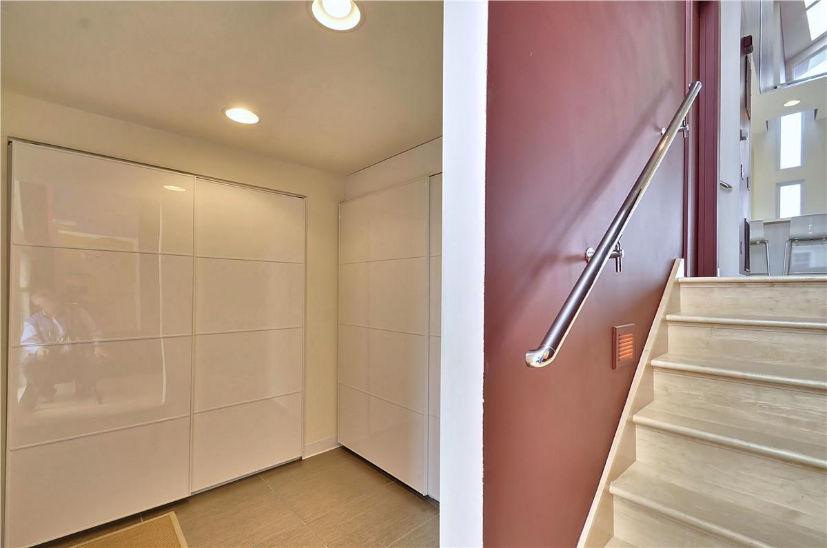 Modern storage and accessibility meet in this thoughtfully designed space. Sleek wardrobes provide ample room for your belongings, while handrails ensure safe movement between floors.