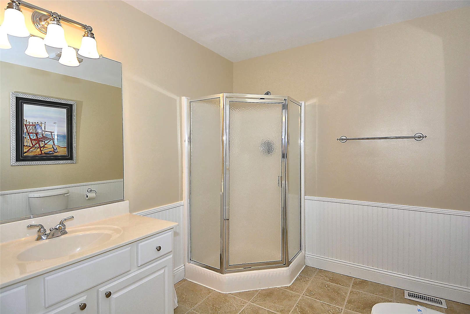 Step into your private bathroom featuring a spacious walk-in shower, well-lit vanity, and thoughtful touches that make getting ready each morning feel effortless.