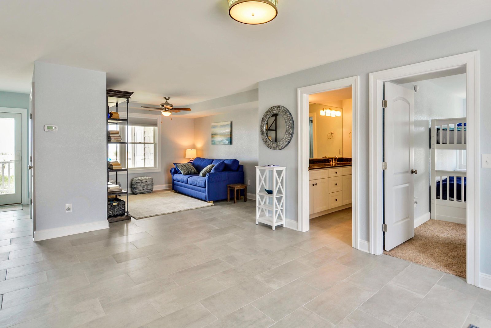 Step into your bright and welcoming retreat, where an open layout connects coastal comfort throughout. Plush seating and coastal charm create a breezy, laid-back vibe perfect for relaxation.