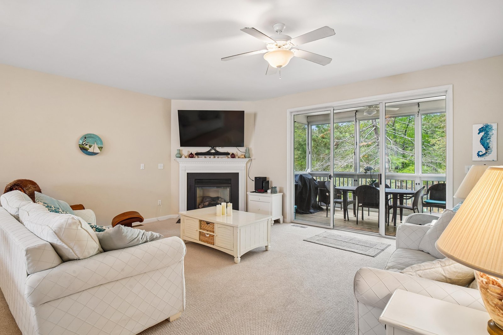 Sink into soft sofas and unwind by the warm fireplace while enjoying your favorite shows. Step outside to your private balcony for fresh air and peaceful tree views.
