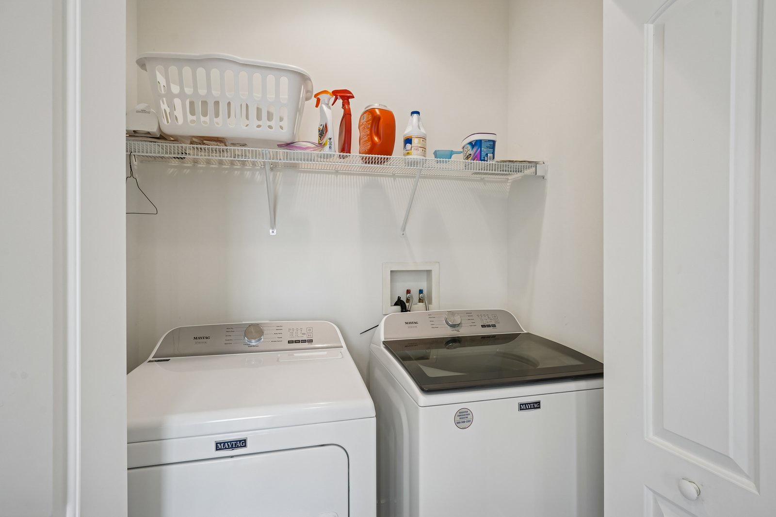 Your dedicated laundry nook keeps your wardrobe fresh with a full-size washer, dryer, and convenient storage shelf for all your cleaning essentials.