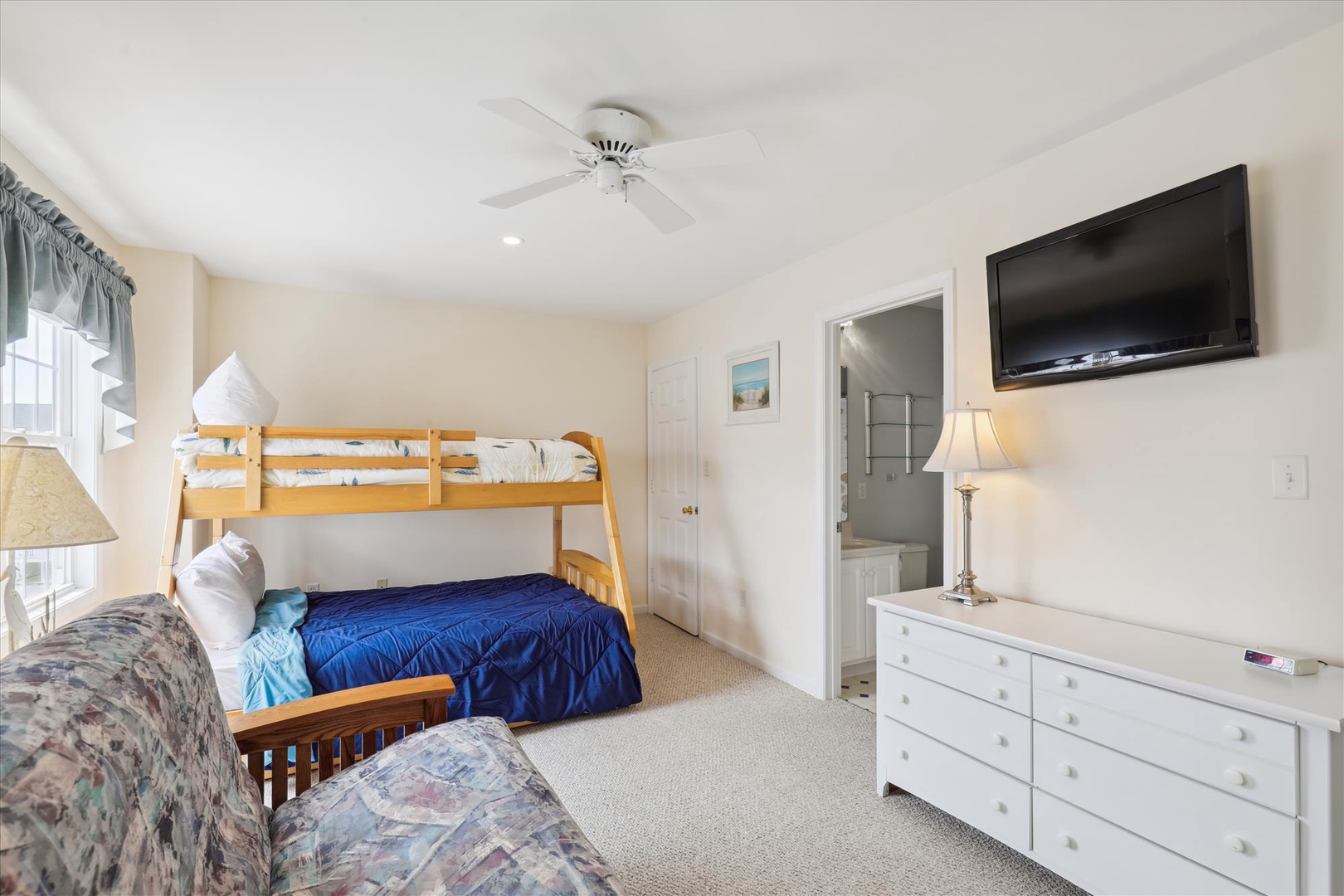 Your family room features cozy bunk beds and a flat-screen TV, perfect for kids to unwind after a day of adventures.