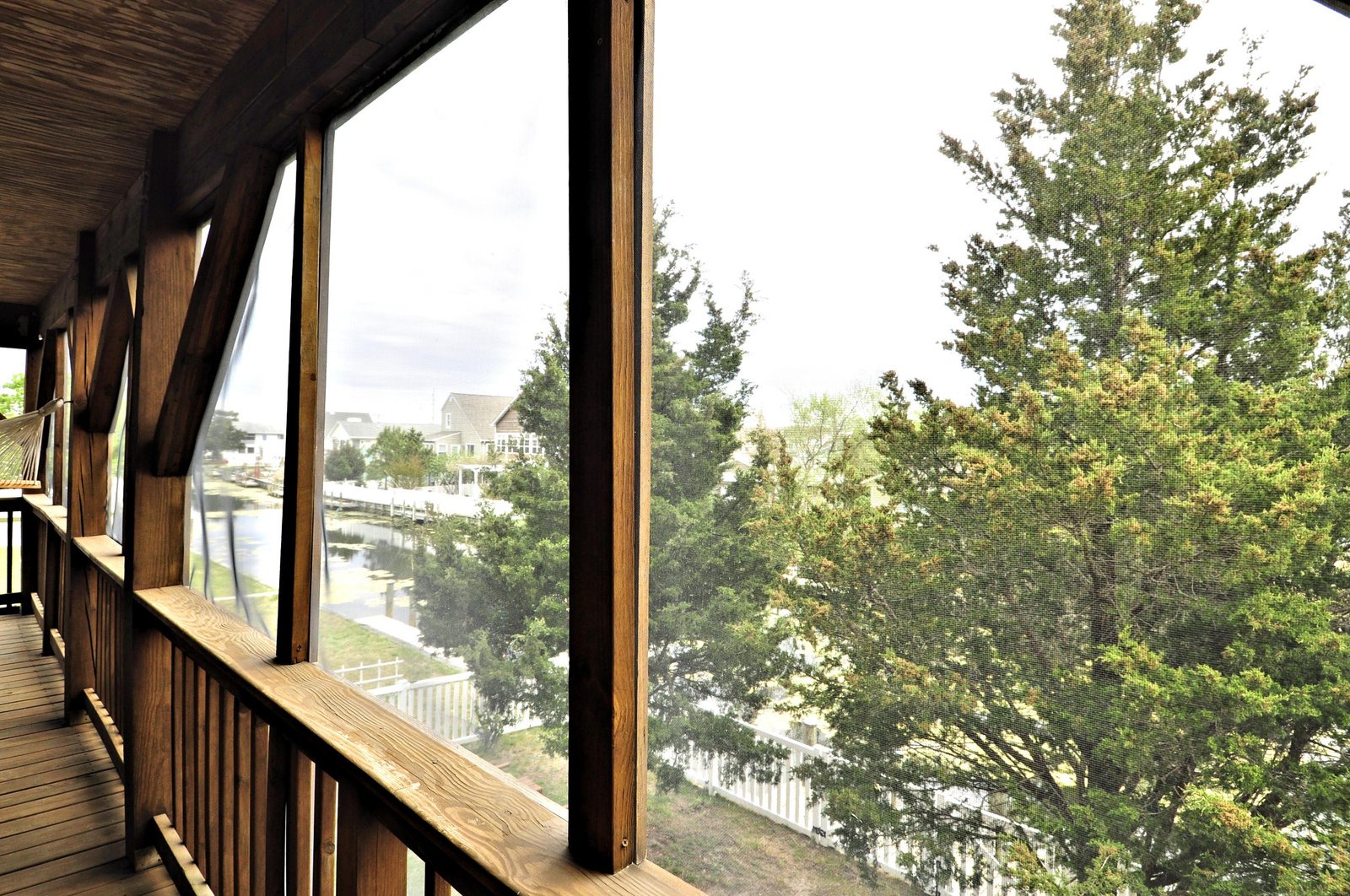 Step onto your private screened balcony and soak in peaceful water and neighborhood views, framed by leafy trees and fresh air.