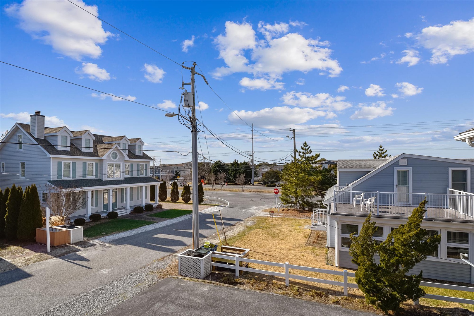 This coastal vacation home sits in a peaceful residential neighborhood, just steps from the beach and local amenities, offering a quiet seaside retreat.