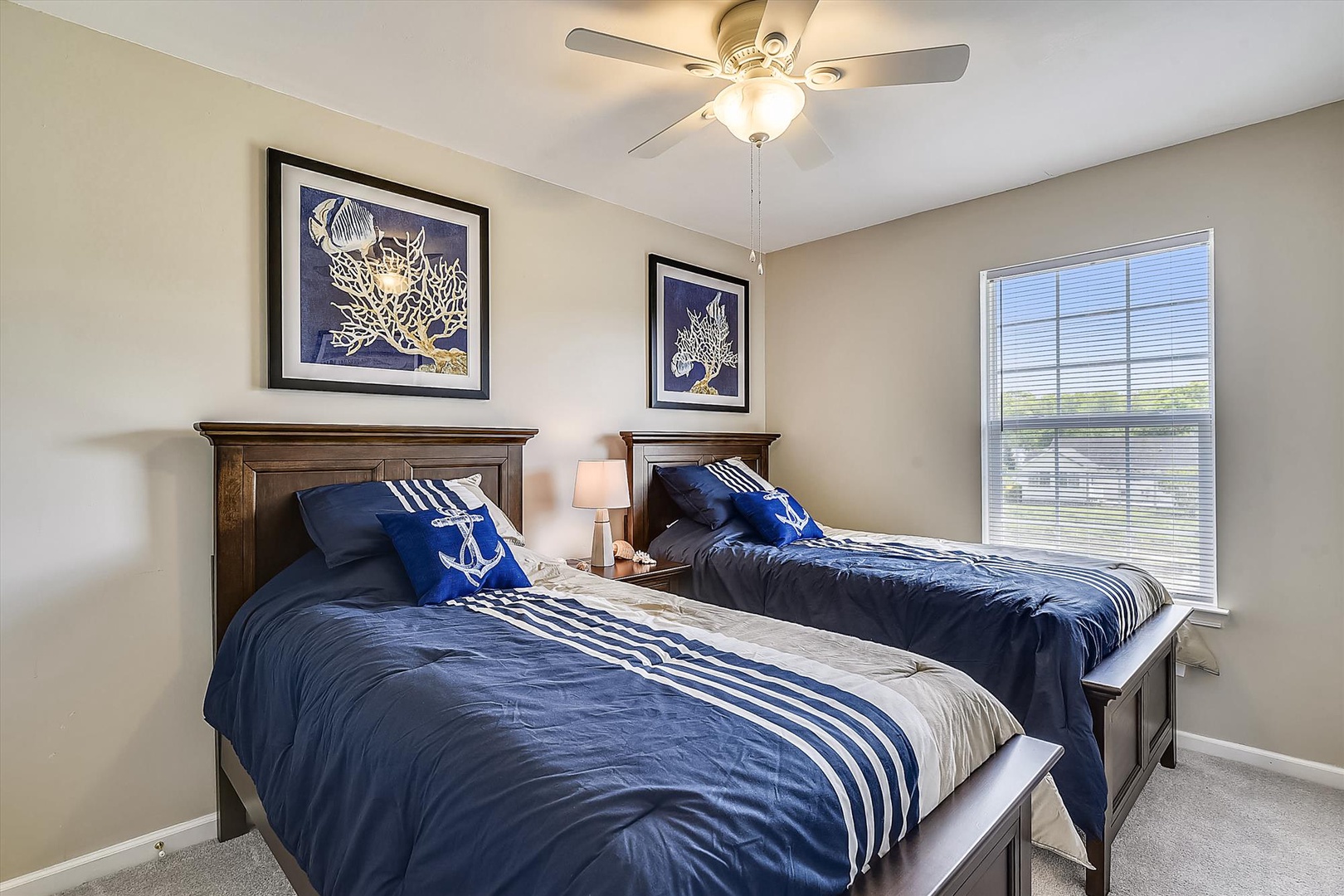 Drift off in your cozy twin bedroom, where nautical touches and soft lighting create the perfect peaceful retreat for restful nights.