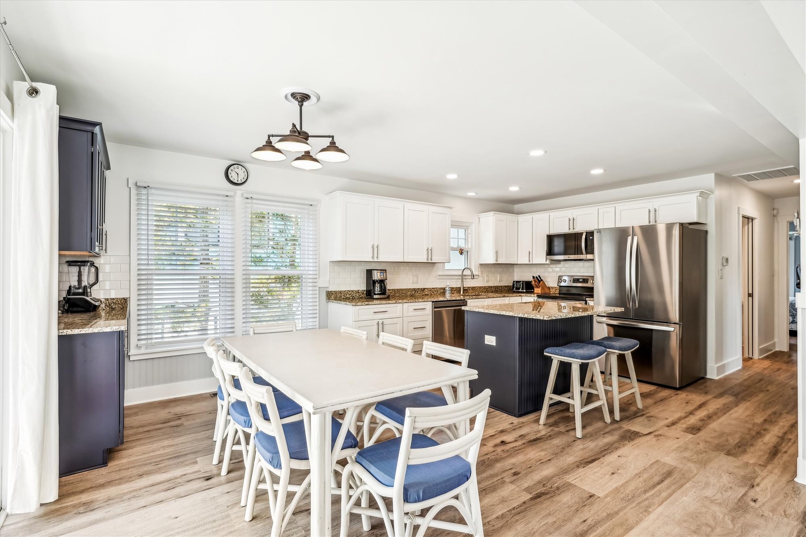 Your spacious kitchen and dining area features granite counters, stainless appliances, and a breakfast island perfect for cooking and gathering.