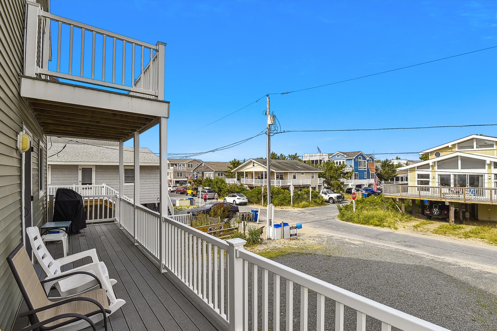 The property is located in a peaceful coastal neighborhood with nearby beach houses, offering easy access to sandy shores and seaside activities.