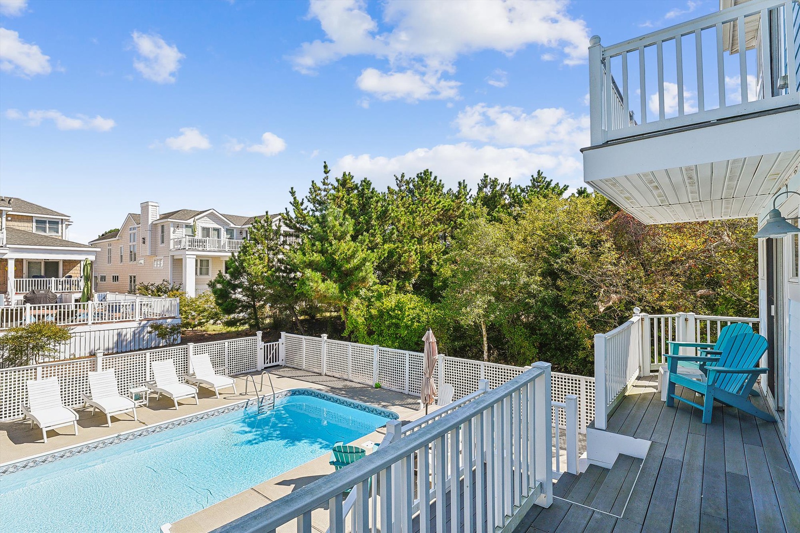 Soak up the sun by your private pool, surrounded by coastal greenery and plenty of deck space. Lounge chairs and cozy seating invite you to relax all day.