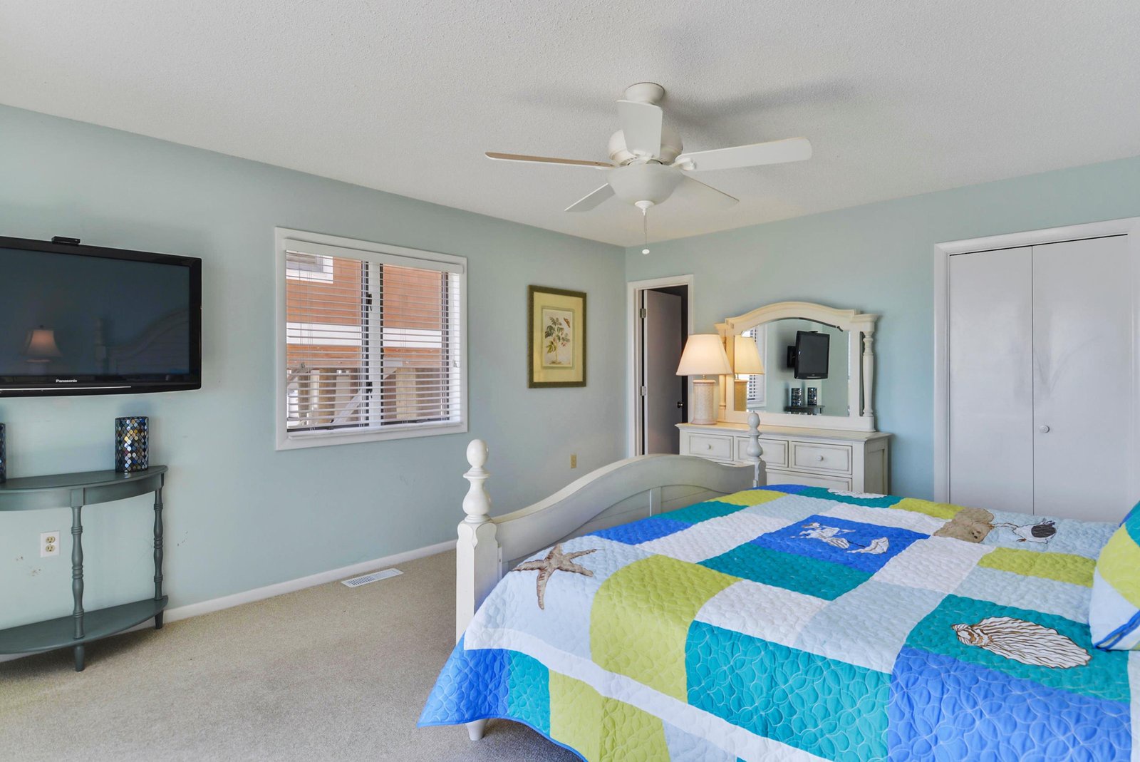 Unwind in your coastal retreat with soft sea-inspired hues, a plush bed dressed in cheerful linens, and gentle ceiling fan breezes. Your personal space offers comfort and calm after a day of adventure.