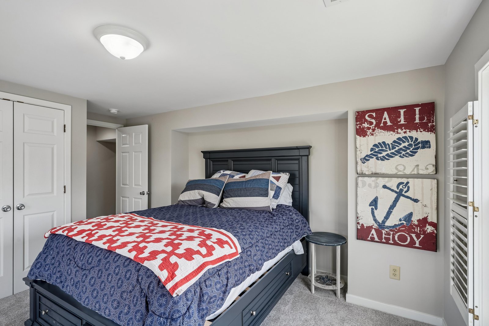 Sink into the plush comfort of this nautical-themed bedroom, where coastal charm meets restful relaxation. Soft linens and cheerful décor create your perfect seaside retreat.