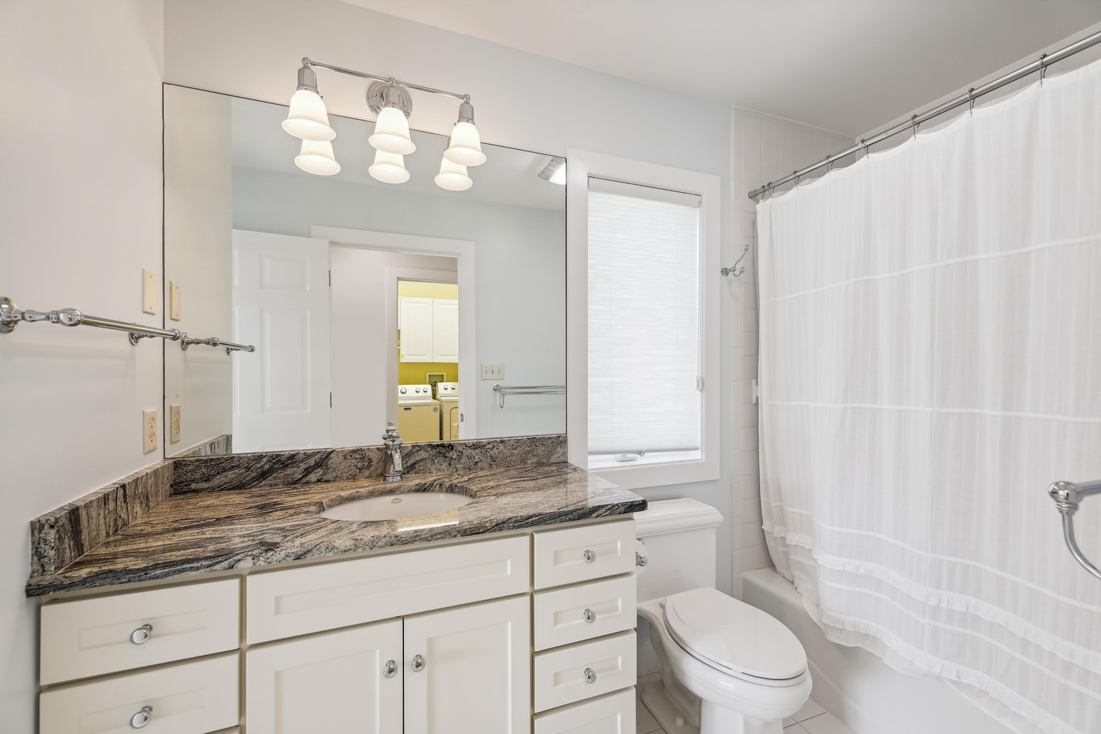 Your private bathroom features elegant granite countertops, crisp white cabinetry, and a refreshing tub-shower combo—everything you need to start each morning feeling renewed.