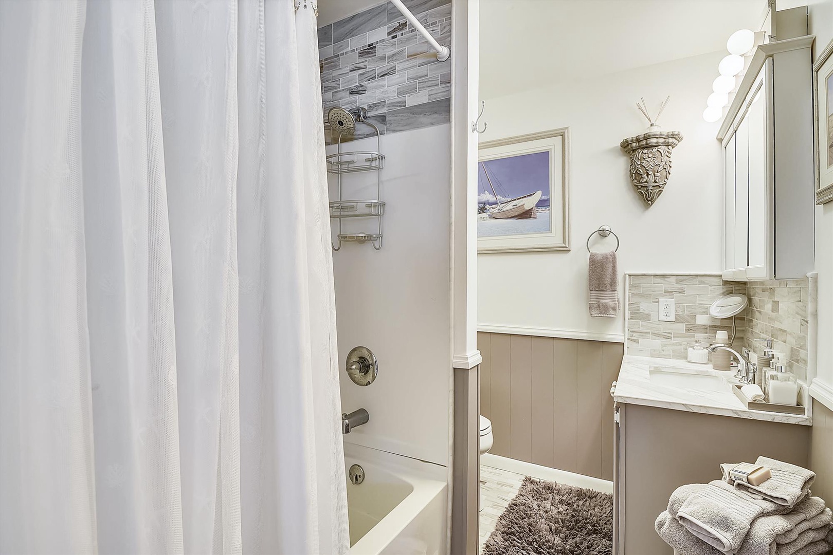 Refresh after your day in this coastal-inspired bathroom, where soft tones and thoughtful details create a spa-like retreat with all the comforts you need.