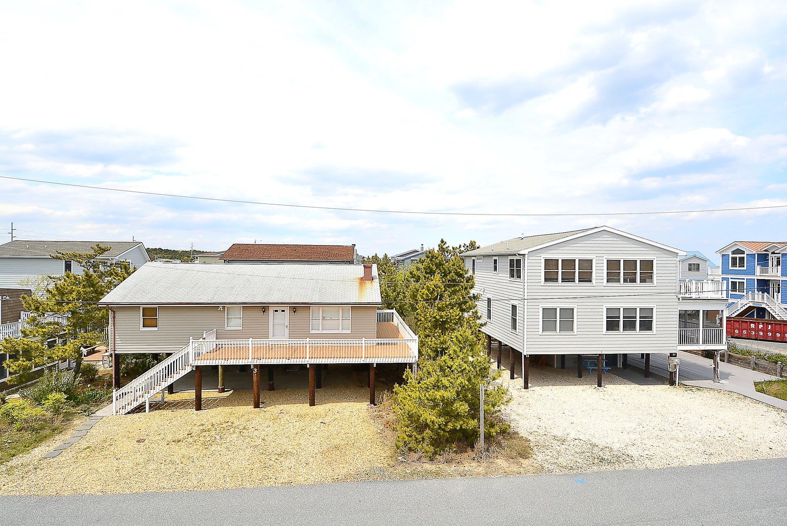 Coastal vacation homes situated in a quiet residential beach neighborhood with convenient parking and easy access to the shore.