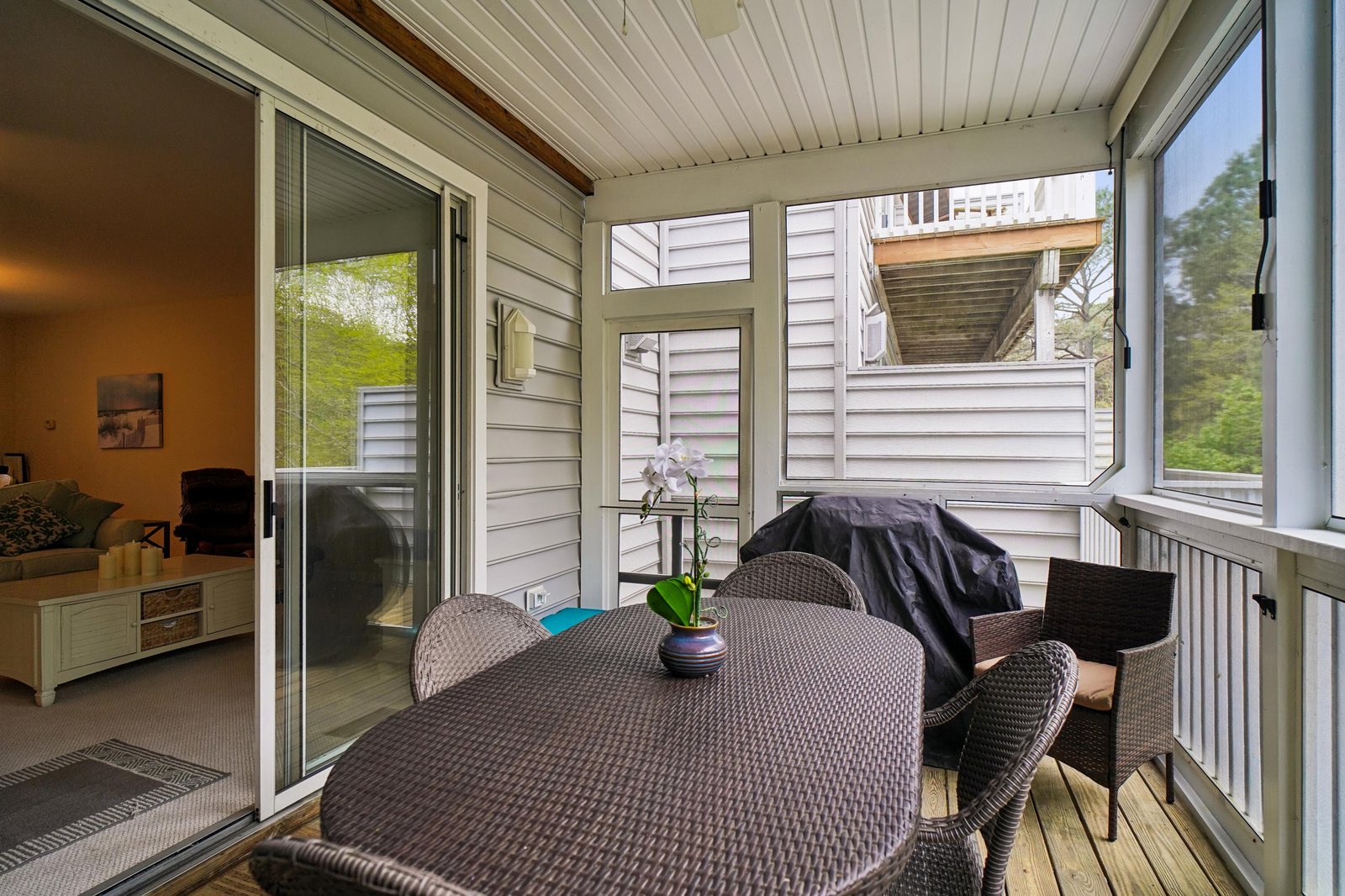 Step onto your private balcony and settle into comfortable wicker seating, where morning coffee feels effortless and evenings invite lingering conversations in your cozy outdoor retreat.