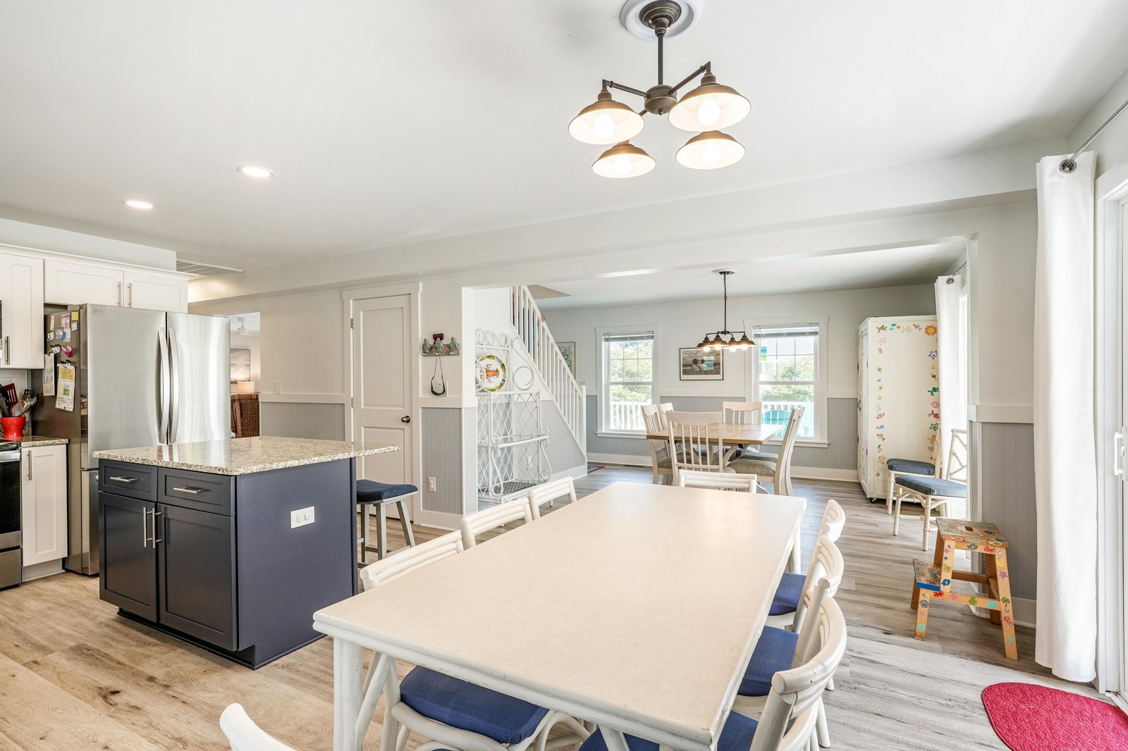 Your open-concept kitchen and dining space invites easy togetherness, with a large island for meal prep and plenty of seating for shared meals and laughter.