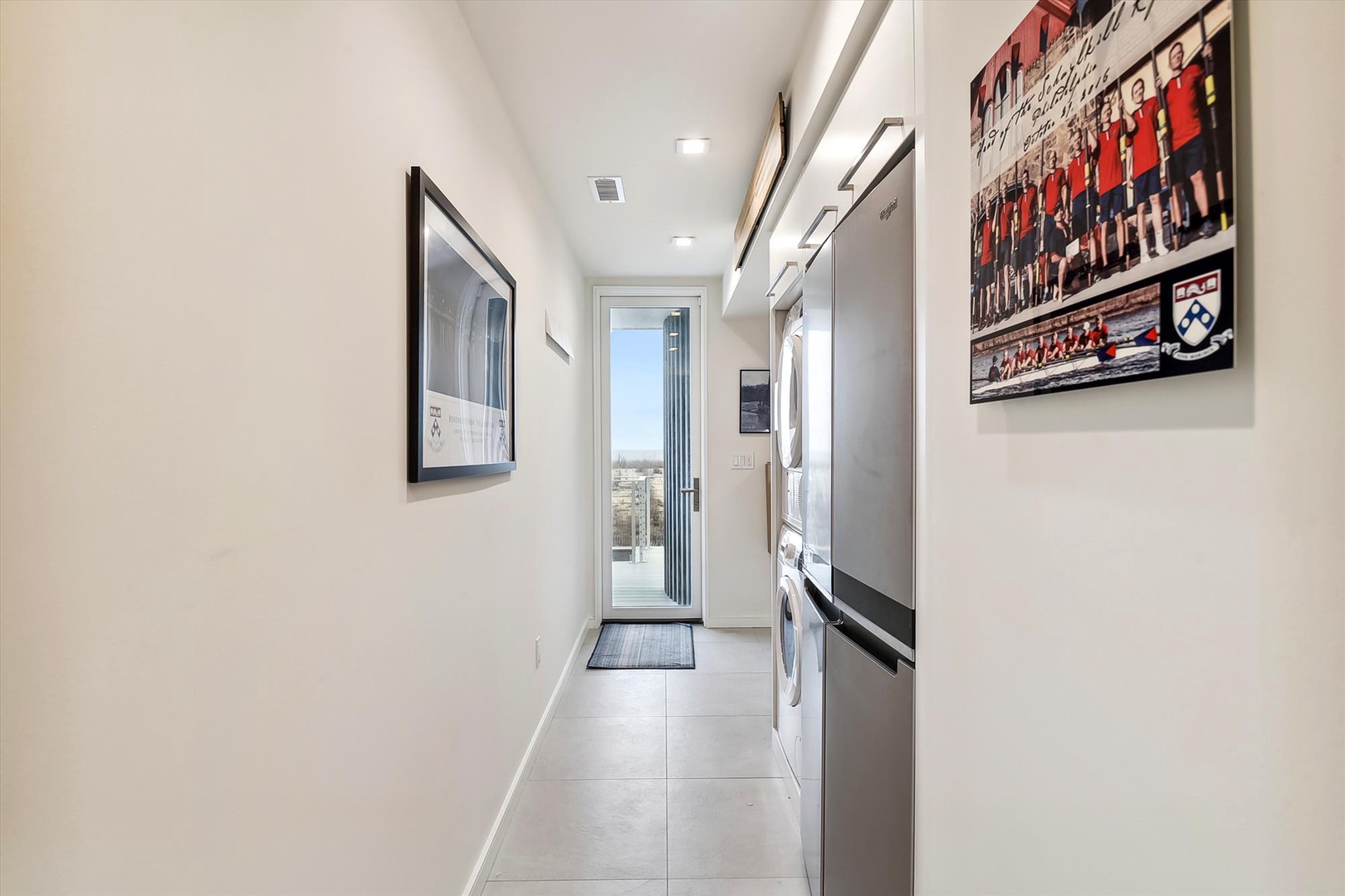 Bright entryway with sleek tile floors and modern appliances leads you into your stylish urban retreat, welcoming you home after exploring the city.