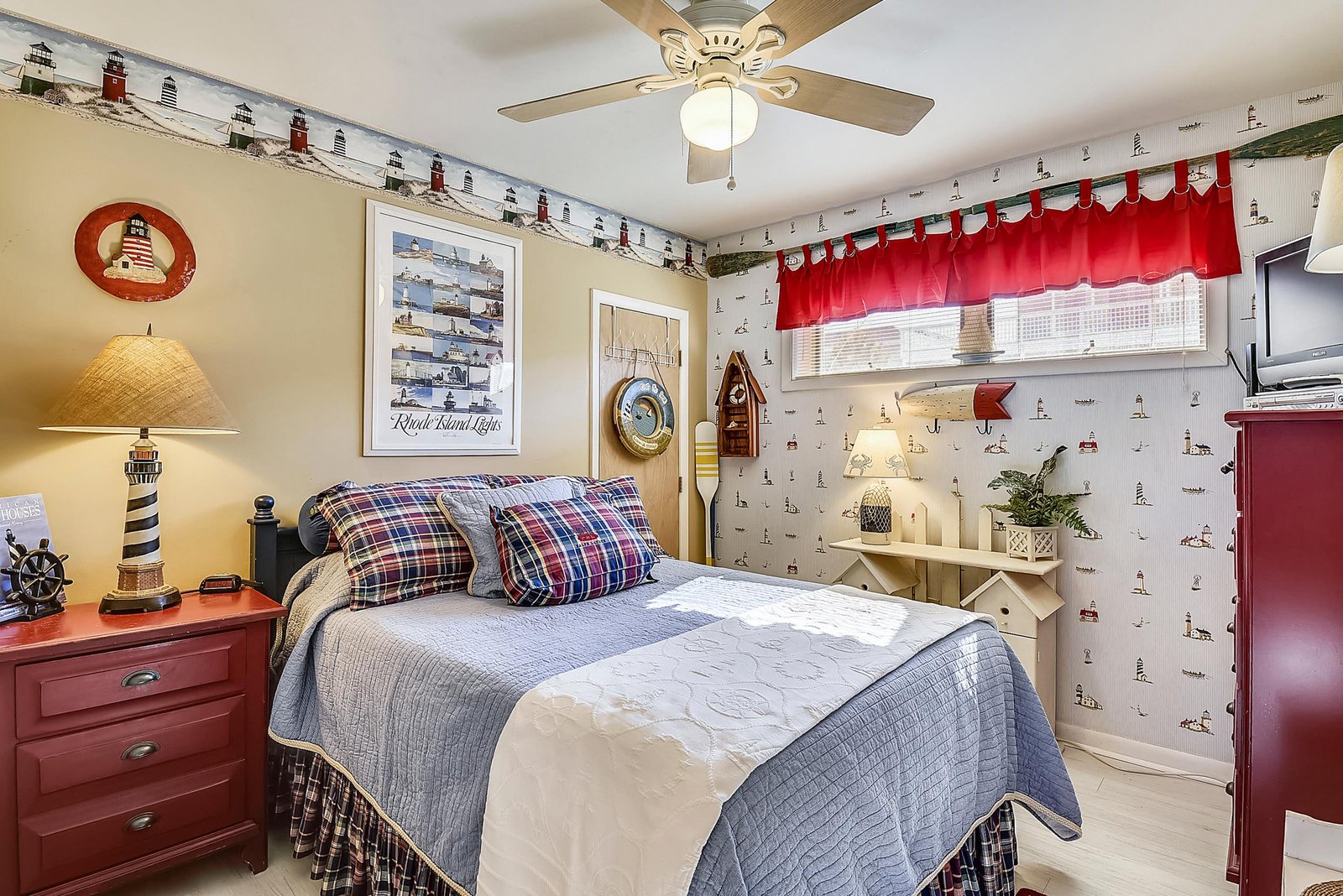 Retreat to your nautical-themed haven, complete with charming lighthouse décor and a cozy bed ready for restful nights by the coast.