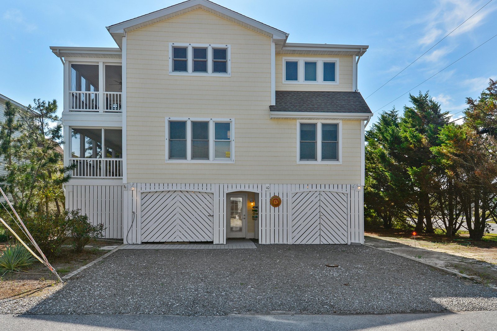 Classic coastal architecture situated in a peaceful tree-lined neighborhood, where coastal charm meets modern comfort and convenience.