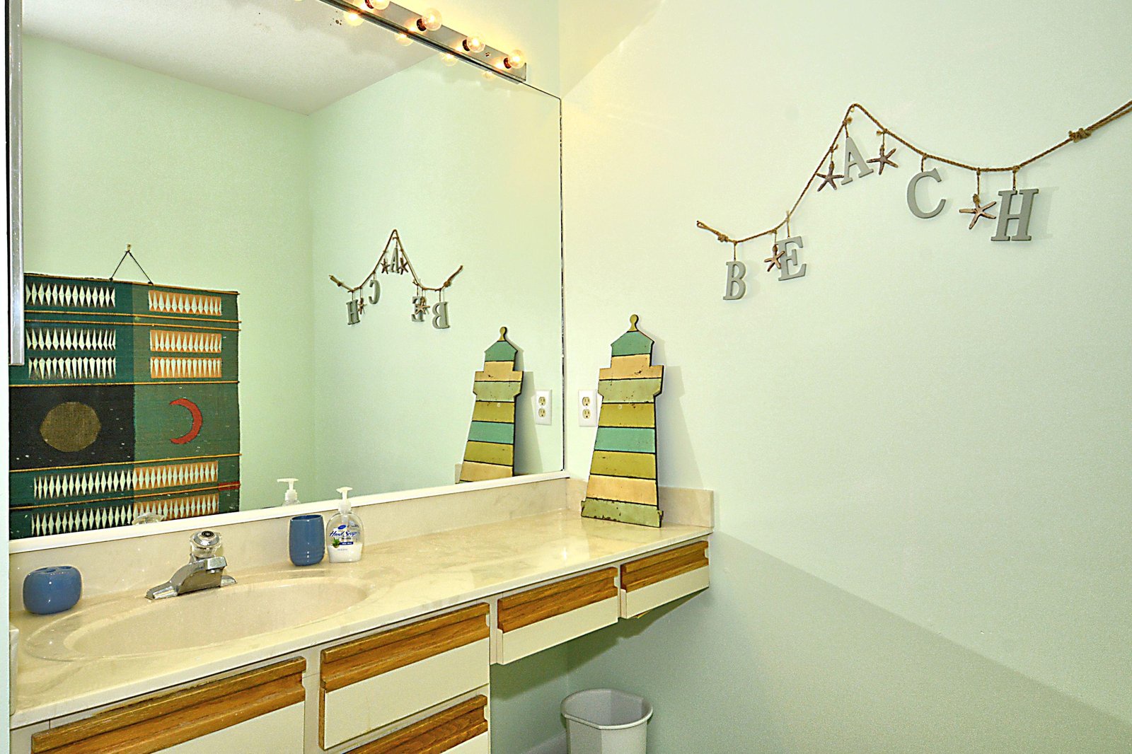 Step into your coastal-inspired bathroom with charming nautical decor and beach-themed accents that make freshening up feel like a seaside escape.