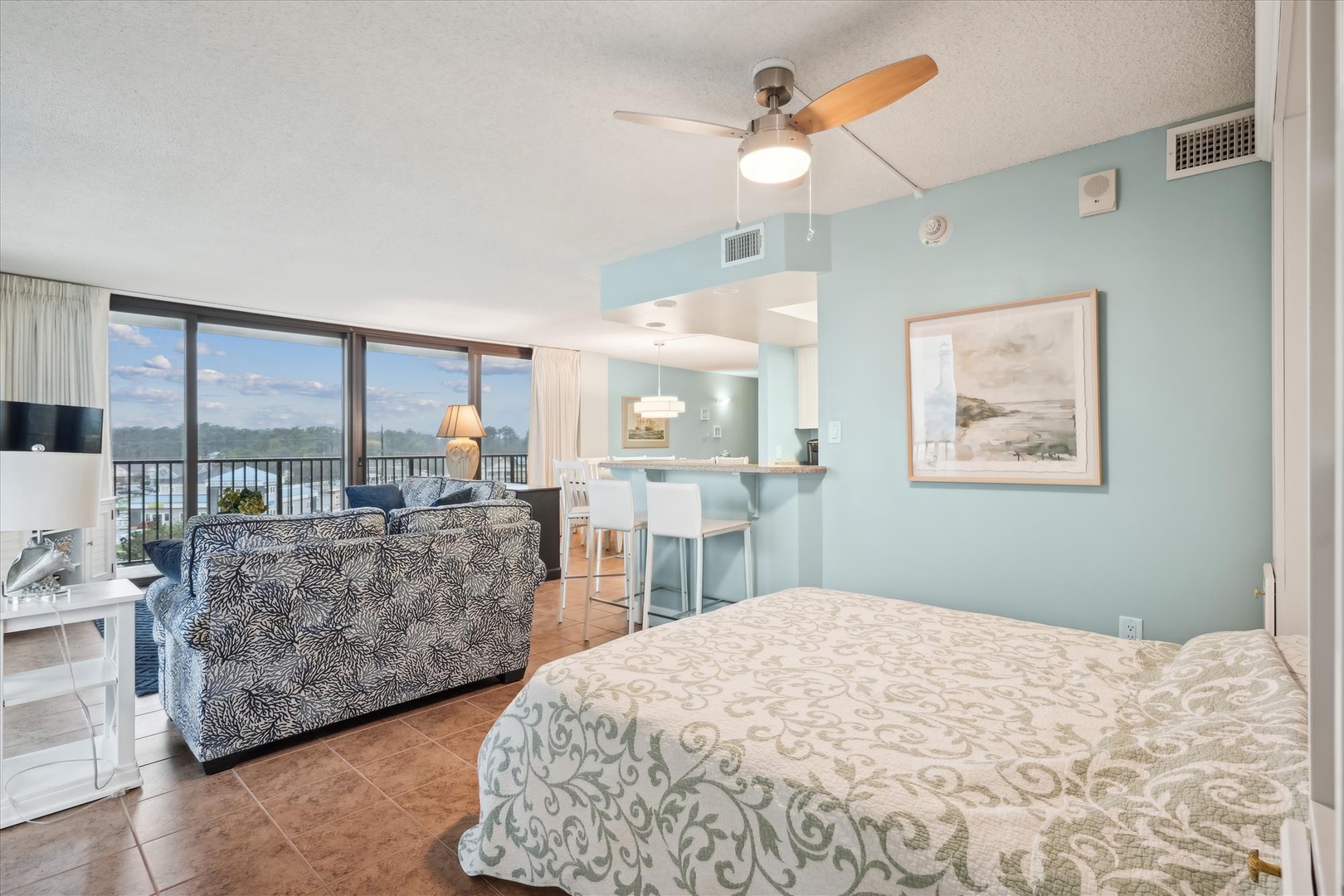 Drift off to sleep in this serene waterfront suite where soft sea breezes and stunning views create your perfect coastal retreat.