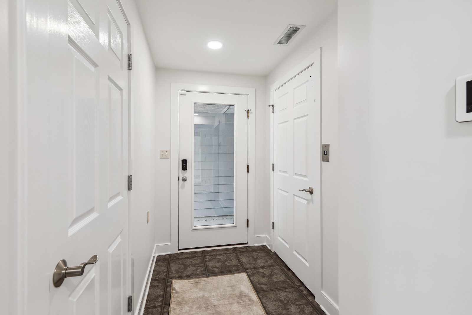 A welcoming entrance hallway greets you with clean lines and modern finishes, setting the tone for your comfortable stay ahead.