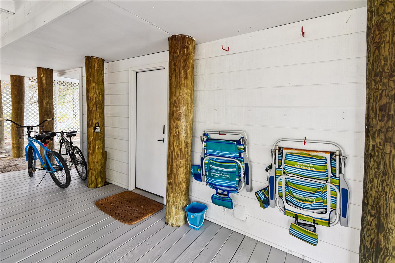 Store your beach gear and bikes safely in this convenient covered area with organized storage for chairs, toys, and equipment.