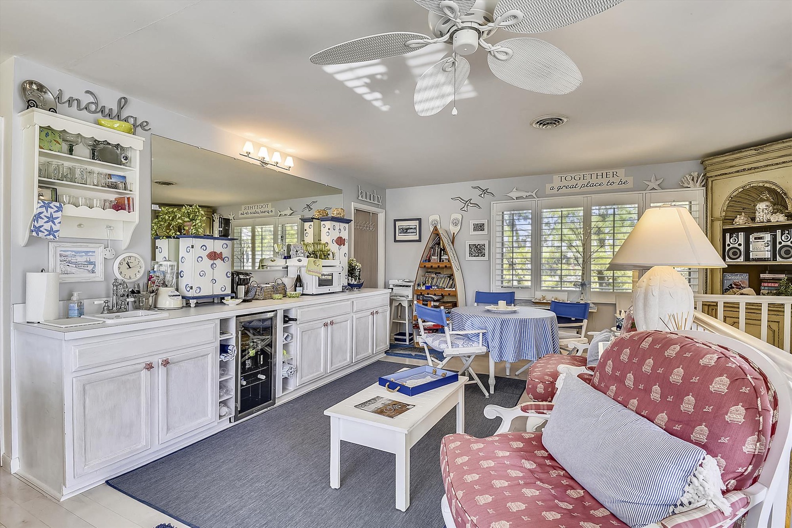 Relax in your coastal-themed living space where comfort meets charm—cozy seating, a fully equipped kitchenette, and nautical touches create your home away from home.