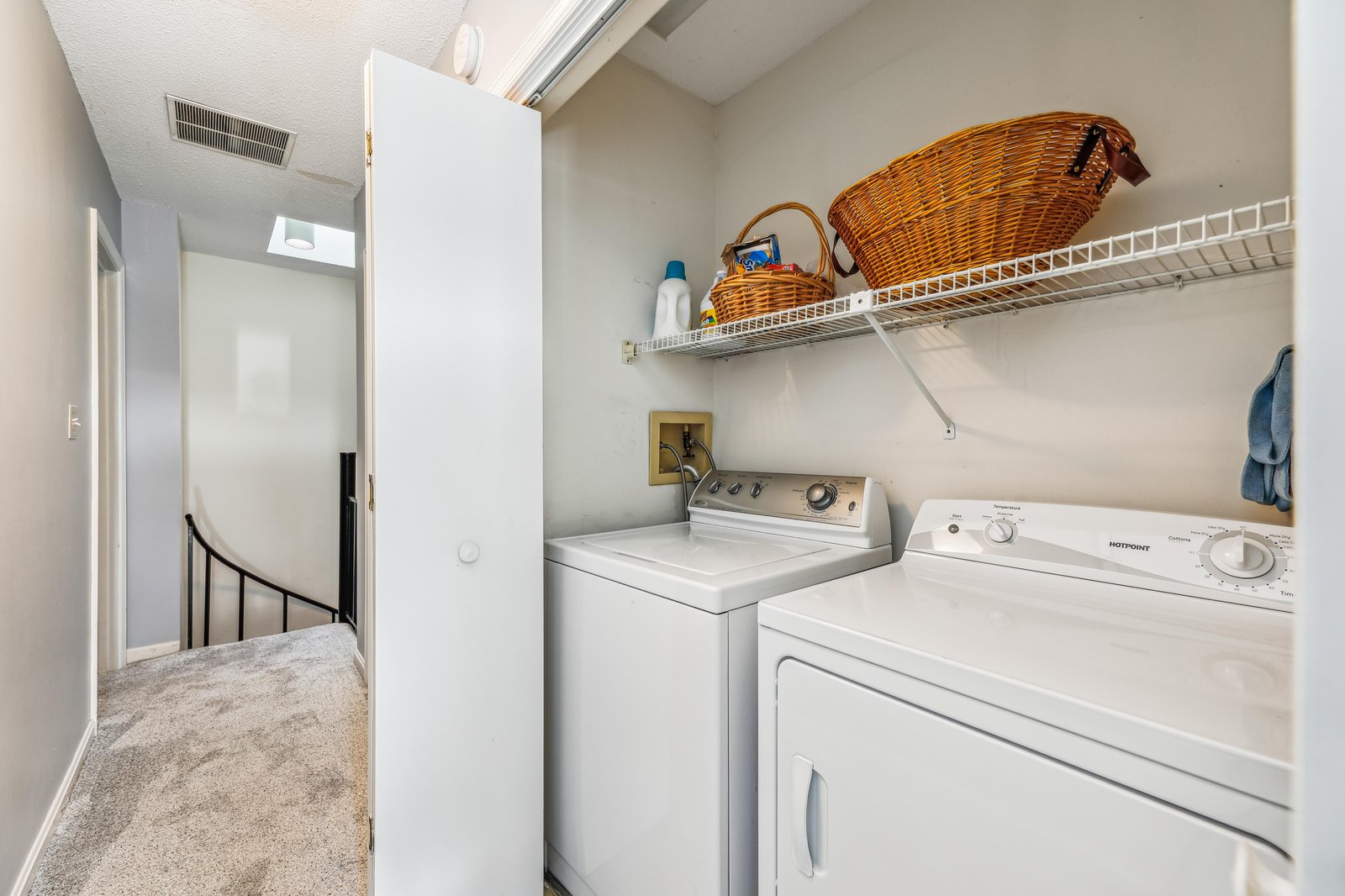 Your laundry needs are covered with in-unit washer and dryer, complete with handy storage above for all your essentials.