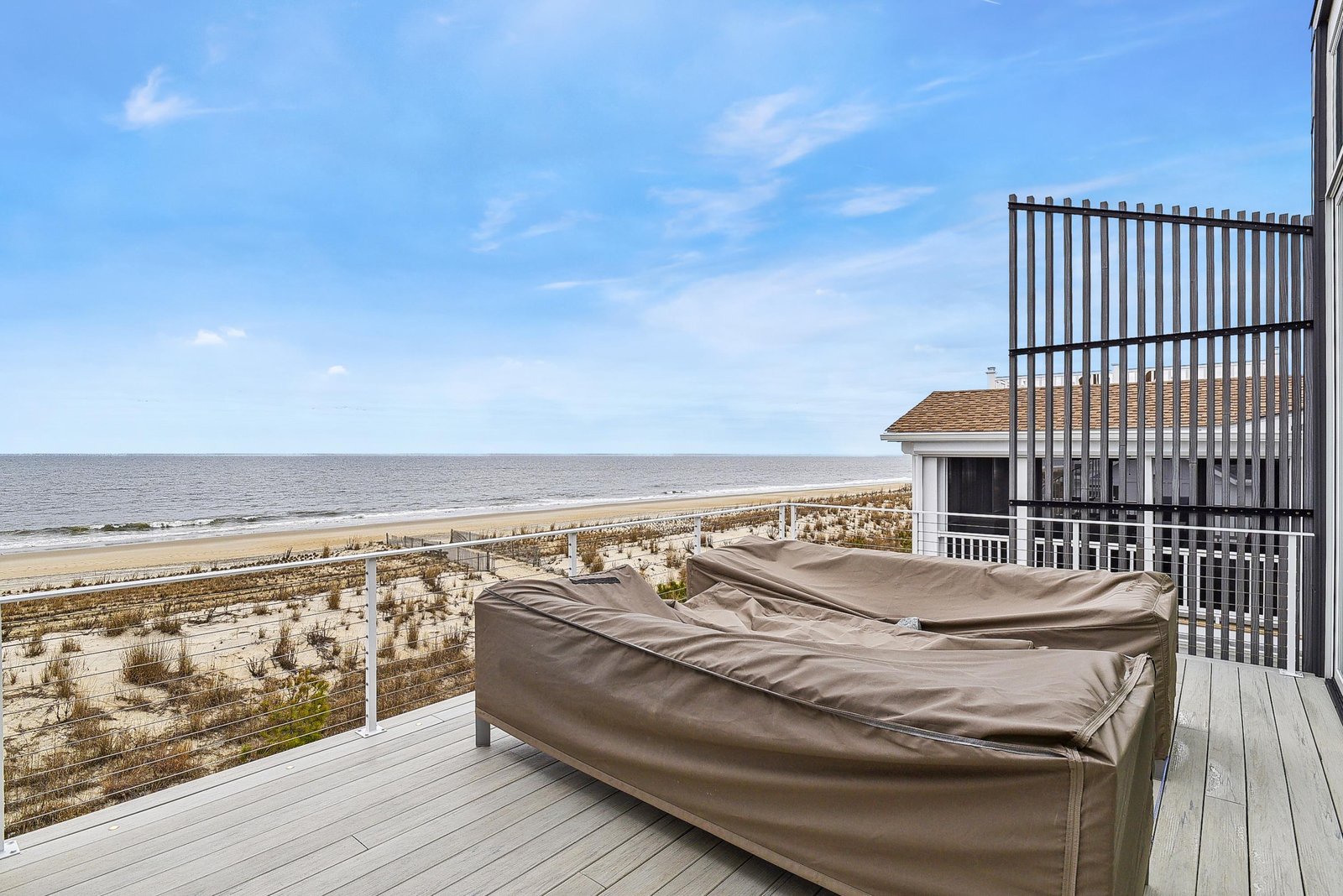 Unwind on your private beachfront deck, where the sound of gentle waves and the warmth of the sun create the perfect escape. Your peaceful retreat awaits.