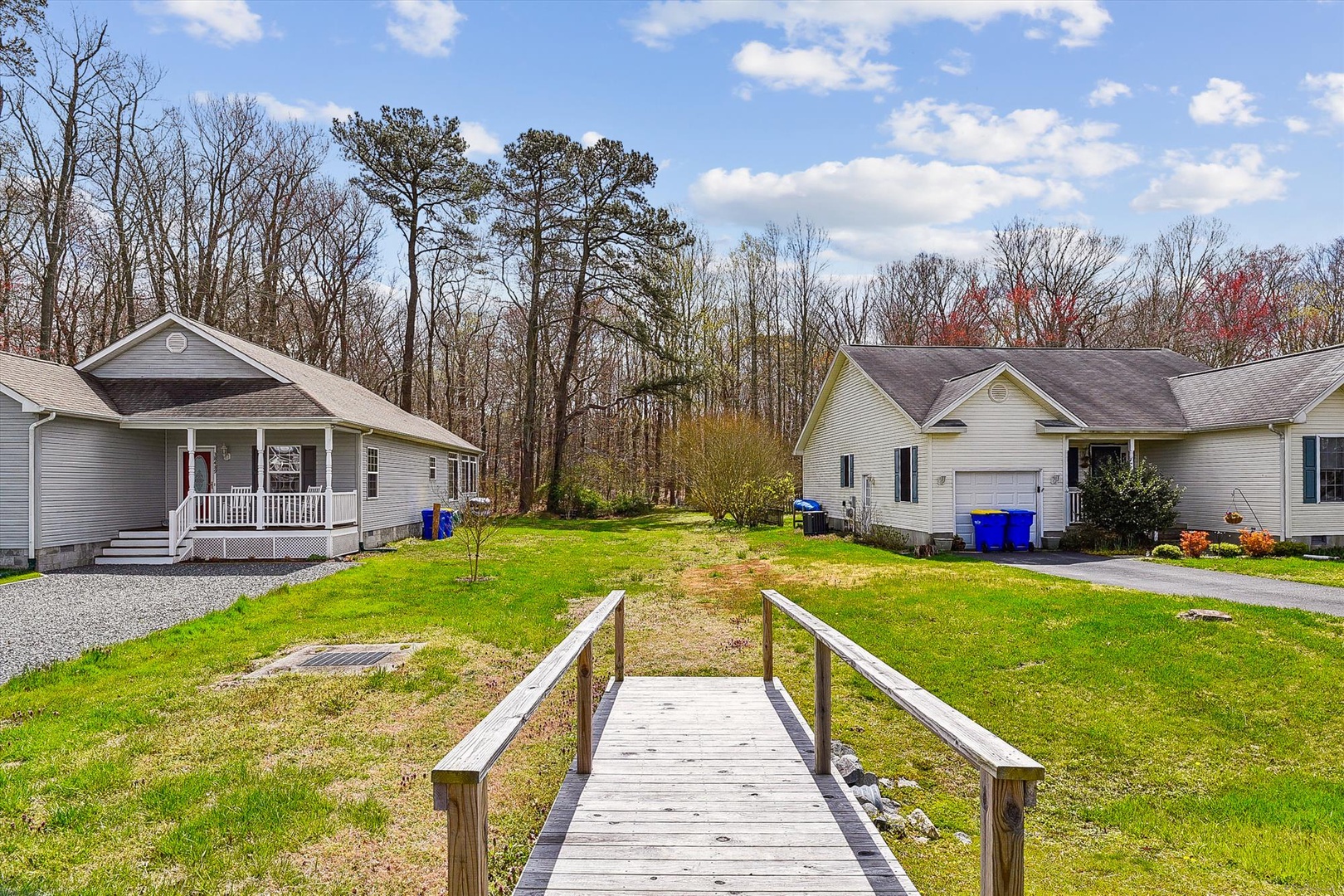 Property nestled in a quiet neighborhood surrounded by mature trees and natural landscape, with accessible pathways and ample parking for guests.