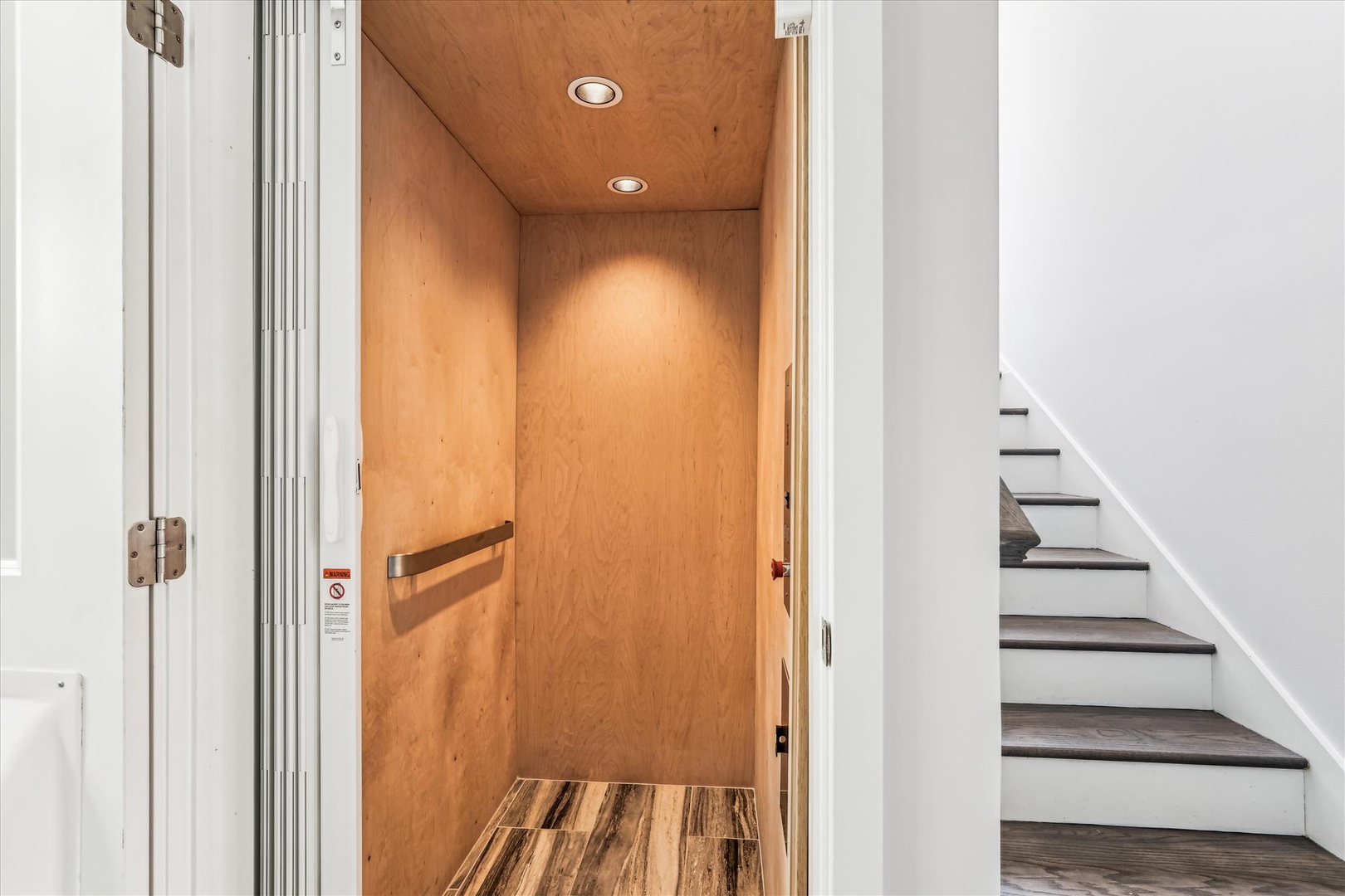 Step inside through your private entrance, where warm wood tones and thoughtful lighting create an immediate sense of home. This inviting space sets the stage for your unforgettable stay.