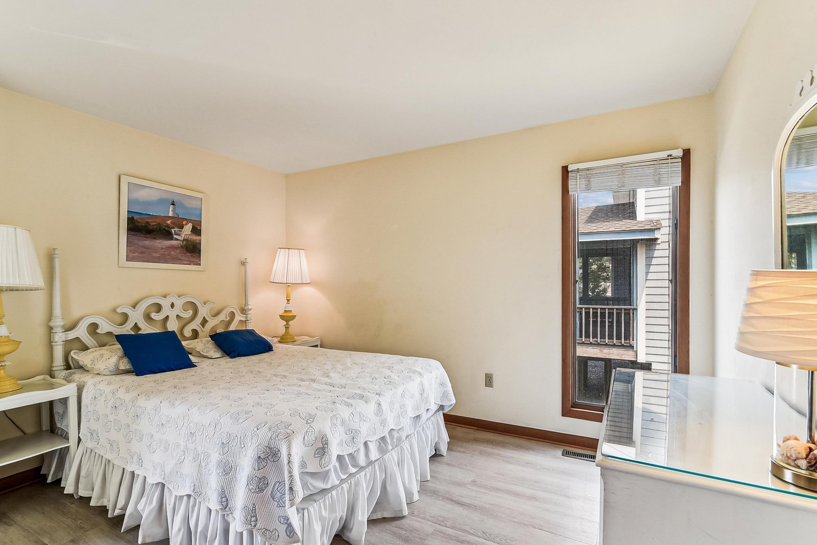 Settle into your peaceful bedroom where soft linens and coastal-inspired decor await. Glass doors open to your private balcony—perfect for morning coffee or evening breezes.