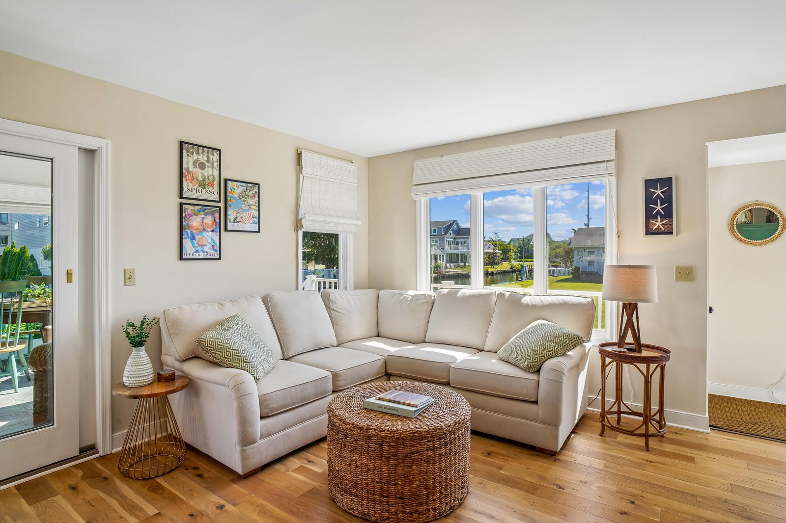 Relax in your bright living room with sunny views and a plush sectional sofa—perfect for unwinding after a day of exploring nearby attractions.