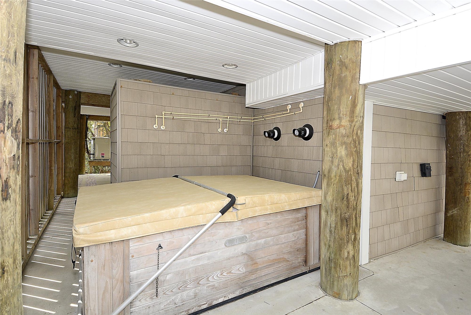Your private outdoor oasis awaits. Slip into the covered hot tub after a day of exploring, with a separate shower nearby for rinsing off the sand and salt.