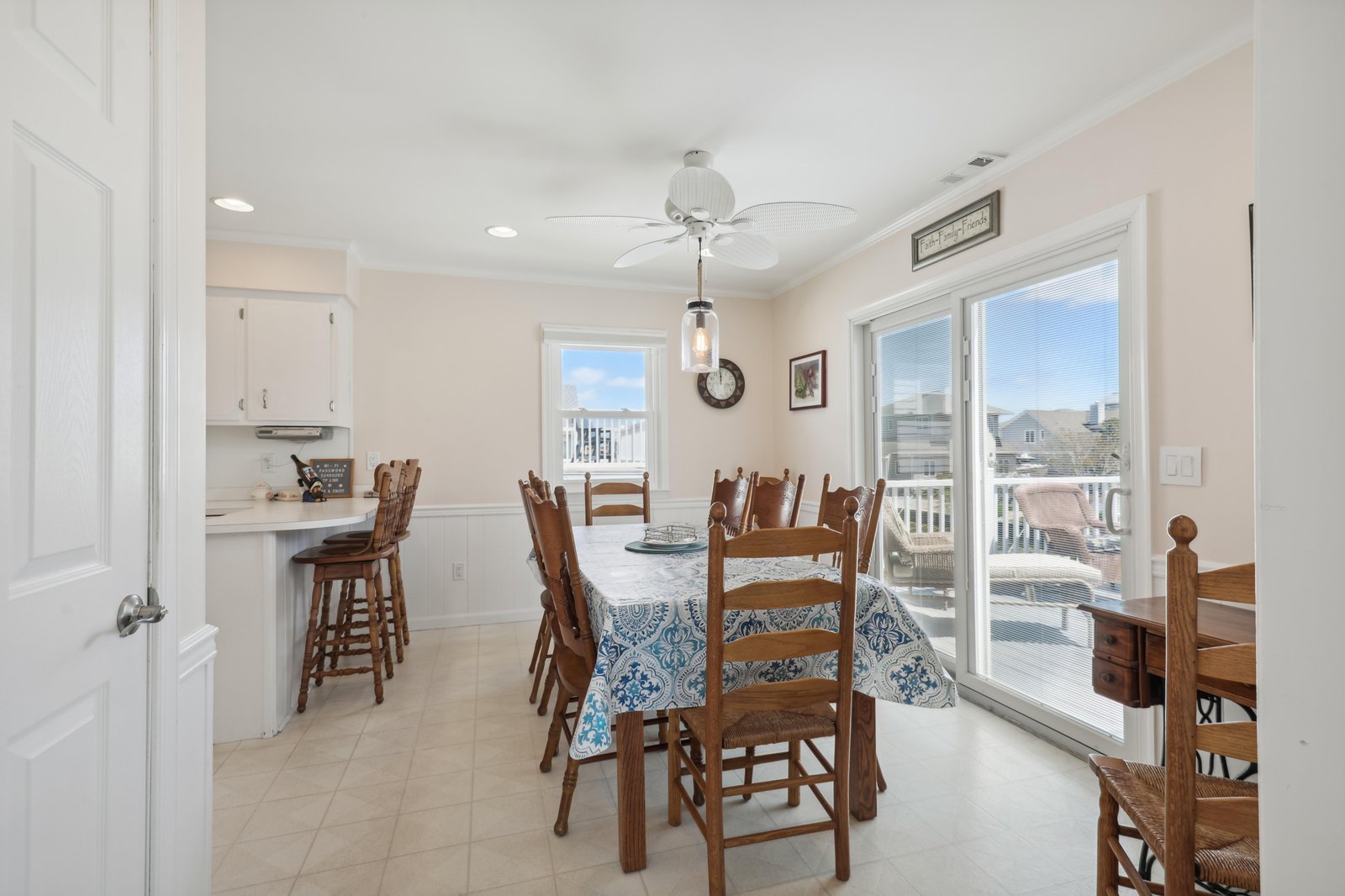 Gather around this bright dining area where natural light fills the space. With doors opening to the balcony, you'll love sharing meals with family and friends in this welcoming room.