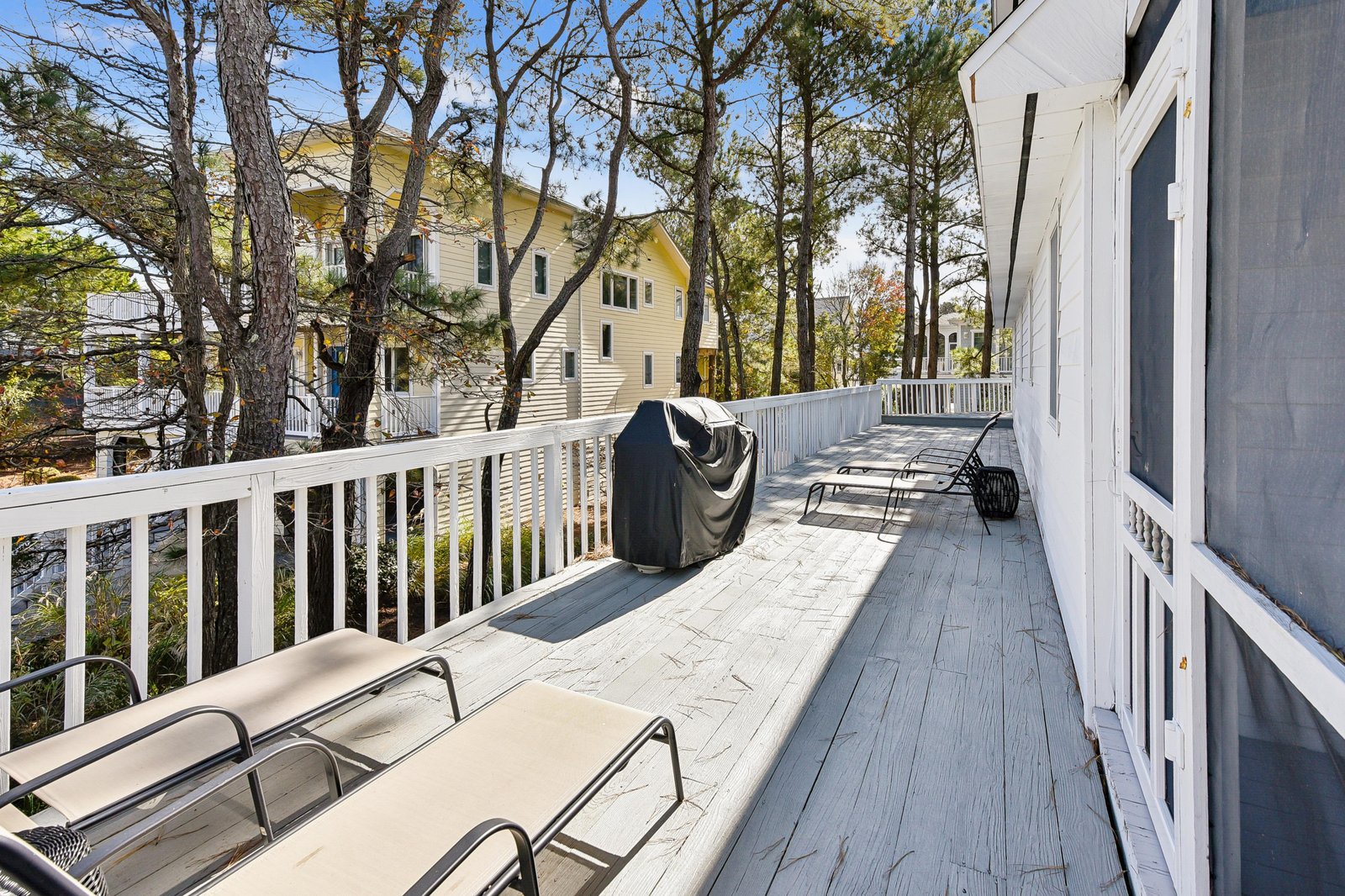 A generous deck nestled among the treetops features loungers and a grill, creating your perfect outdoor retreat for relaxation and gathering with friends and family.