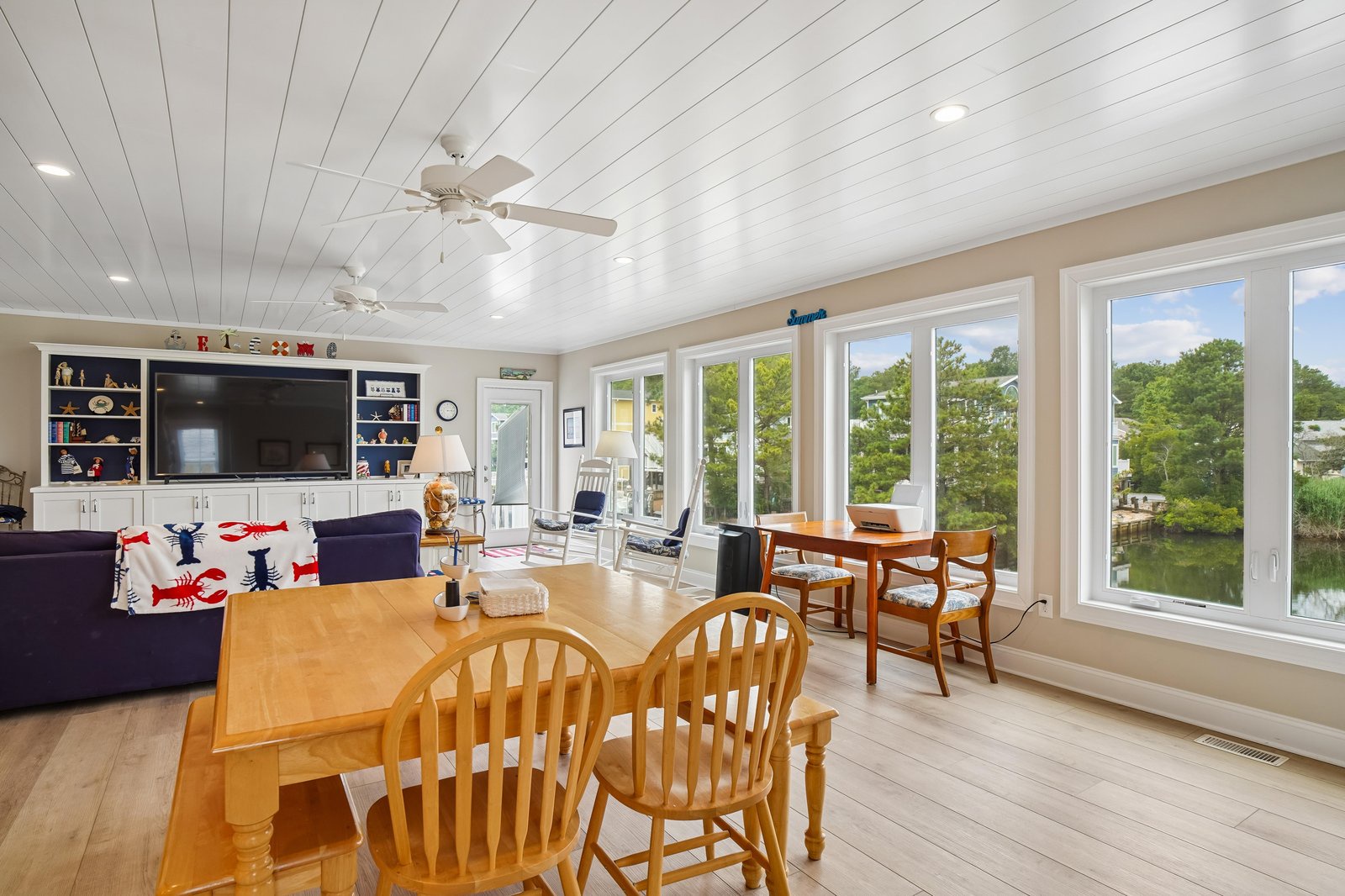 Relax in your bright, spacious living and dining area with stunning water views through floor-to-ceiling windows—perfect for peaceful mornings and unwinding after a day of adventure.