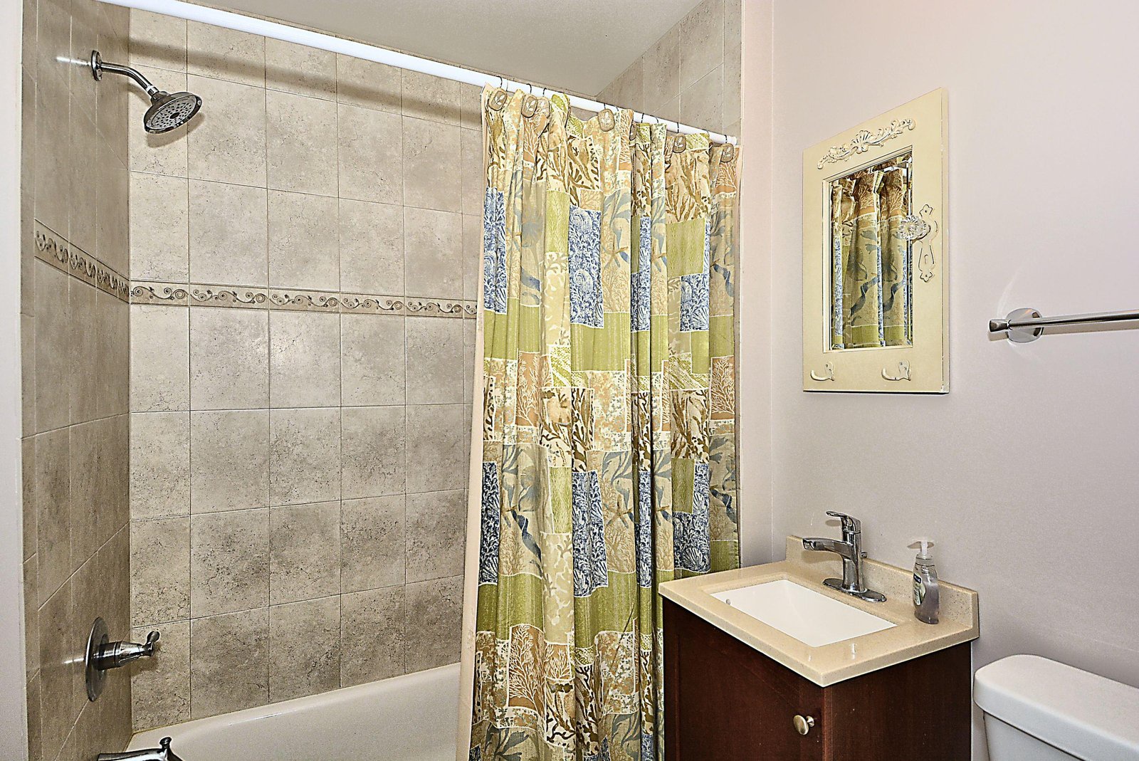 Refresh after your adventures in this pristine bathroom, featuring a tiled tub-shower combo and modern vanity. The bright, clean space offers all the comforts you need to unwind.
