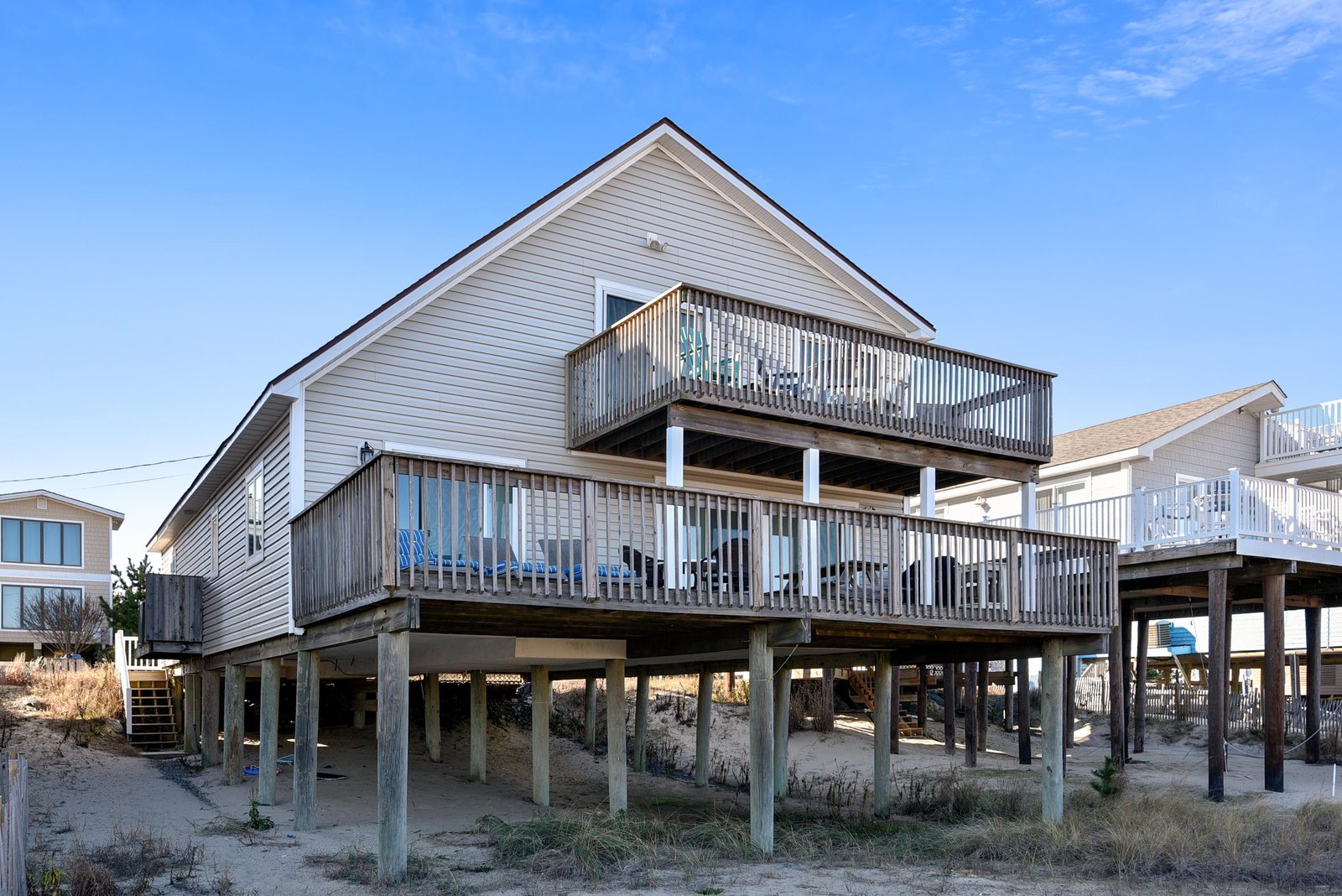 This coastal retreat sits on stilts with two-level oceanfront decking, positioned right in the dunes. A classic beach house design built to embrace coastal living and weather.